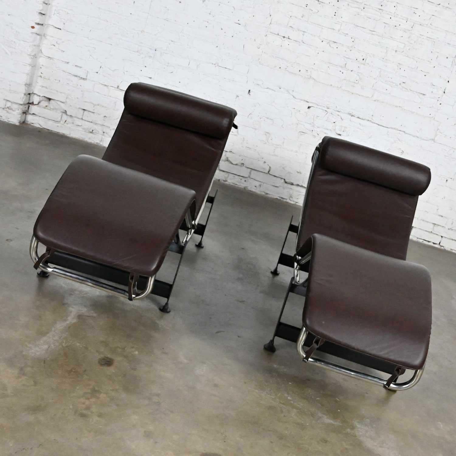 Fabulous pair chaise lounge chairs with chrome frames, black painted steel bases, and brown leather cushions in the style of Le Corbusier LC4. Not an “official” chair. Beautiful condition, keeping in mind that these are vintage and not new so will