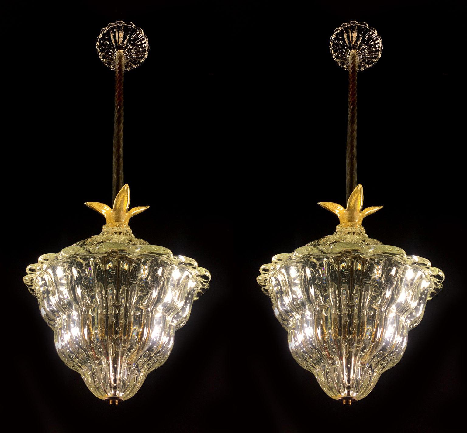 Pair of lantern of incredible beauty in massive Murano glass with inclusions of gold.

Three pieces are available.