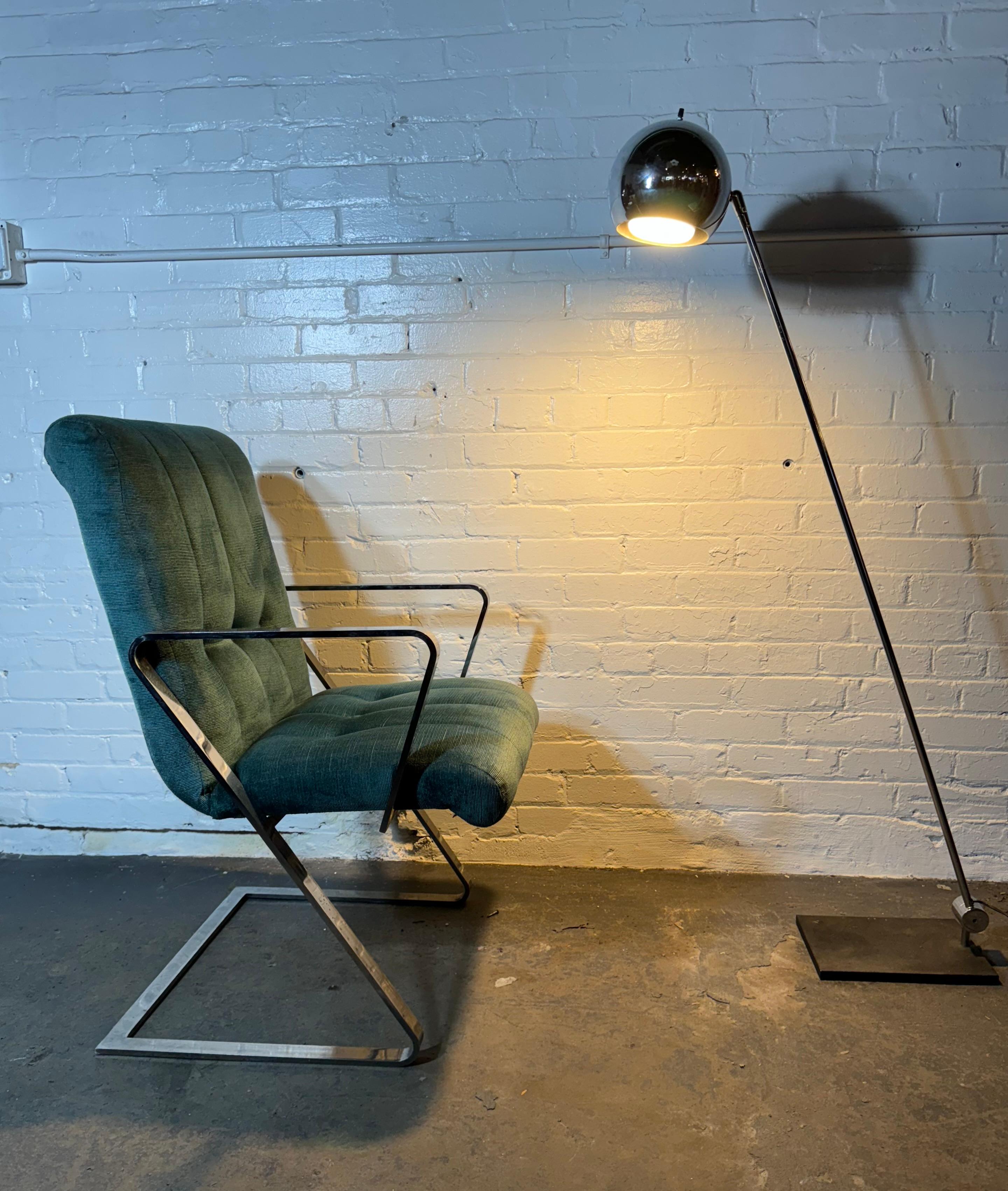 Matched Pair cantilevered, Z frame, chromed flat bar steel dining arm chairs. Original channeled and button tufted  upholstery with rolled top seat backs. Quality and style similar to designs from Brueton and Milo Baughman. Hand delivery avail to