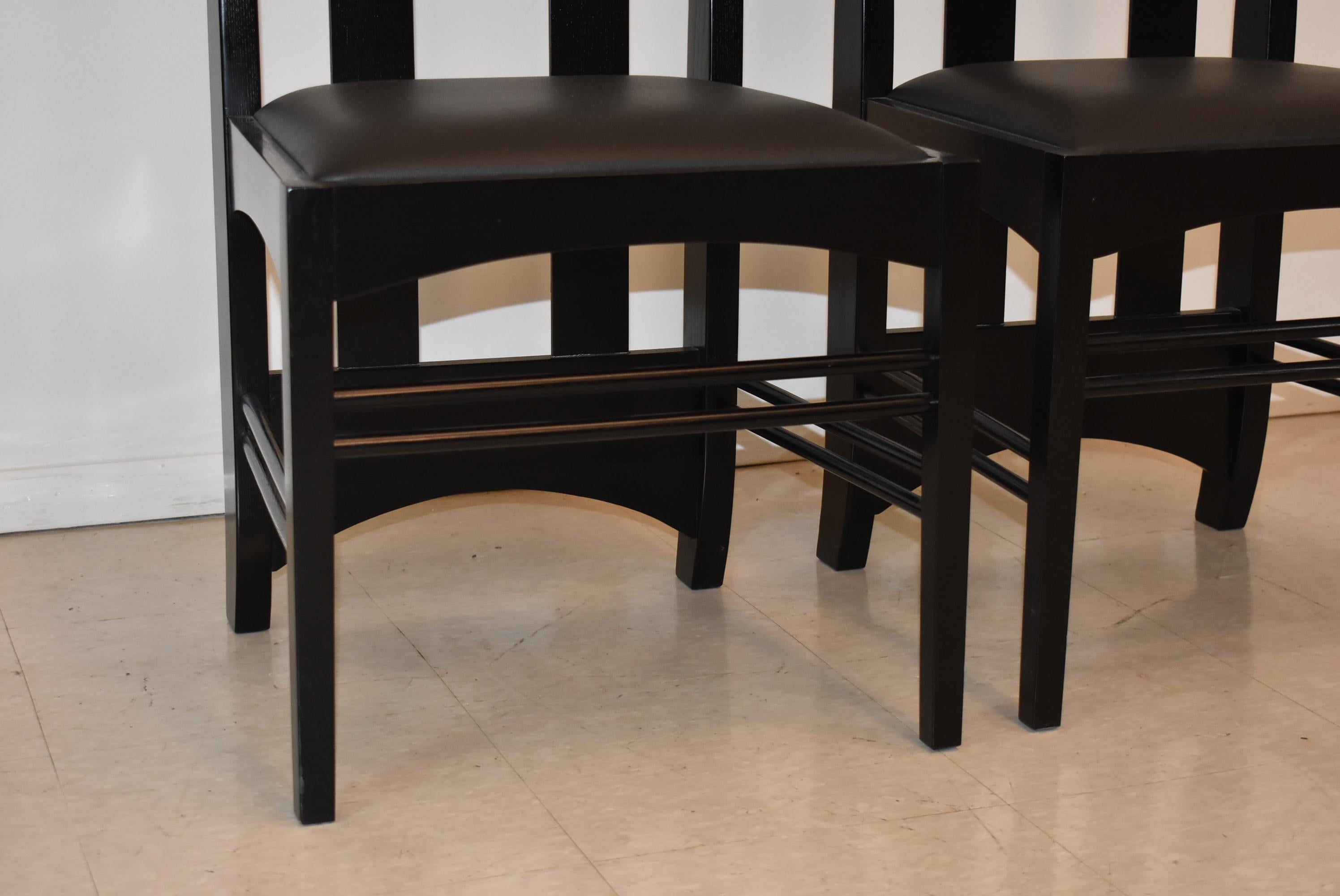 Pair of ash black lacquer finish Arts & Crafts chairs by Charles Macintosh for Cassina. Cutout back details.