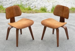 Pair Charles & Ray Eames for Evans DCW Dining Chairs in Walnut & Cowhide c. 1946