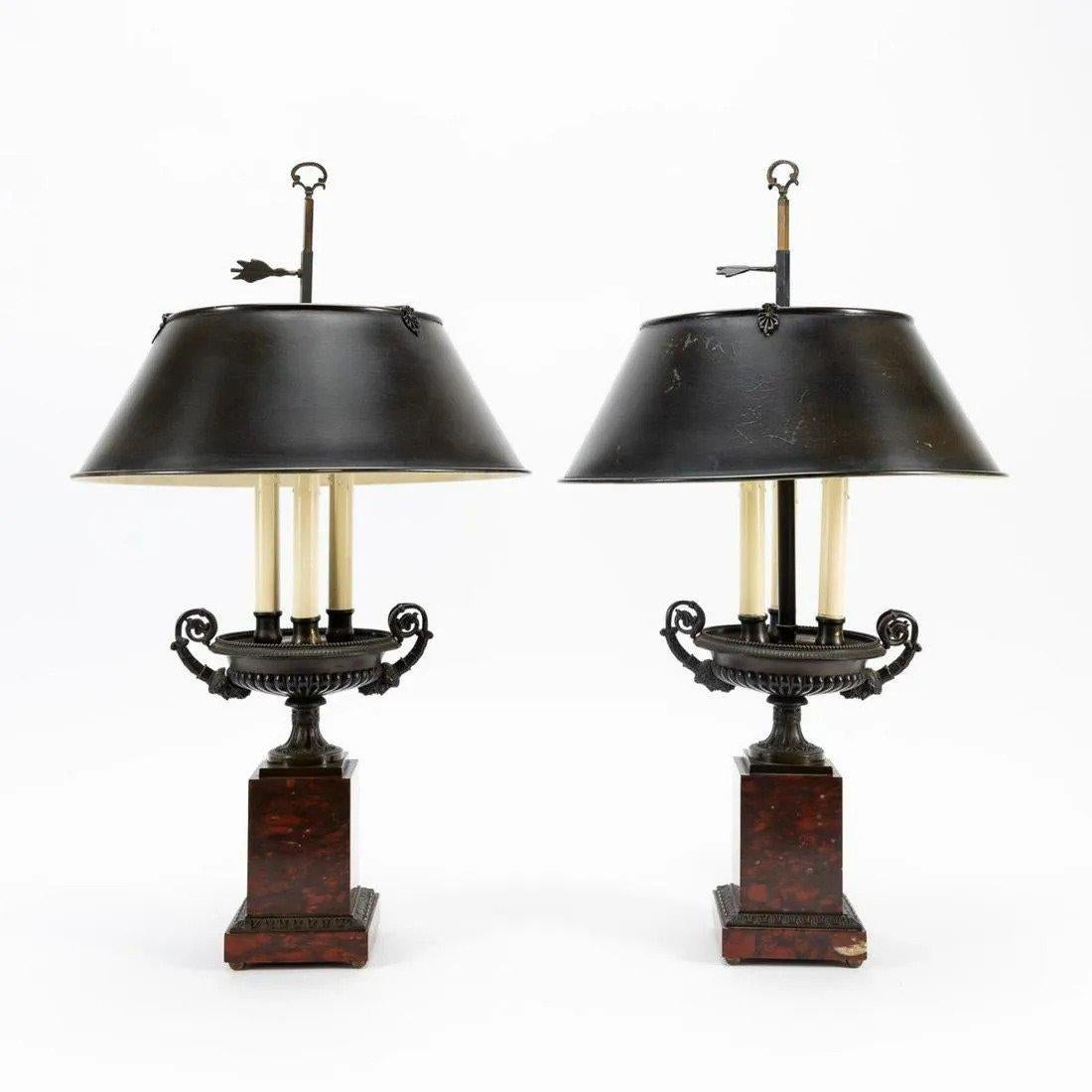 French, 19th century with later fittings, pair of Charles X Grand Tour bronze urn-form tazze, now mounted as three-light lamps with tole shades, each having figural mask decorated arms, gadrooned urn and red griotte marble base with rais-de-coeur