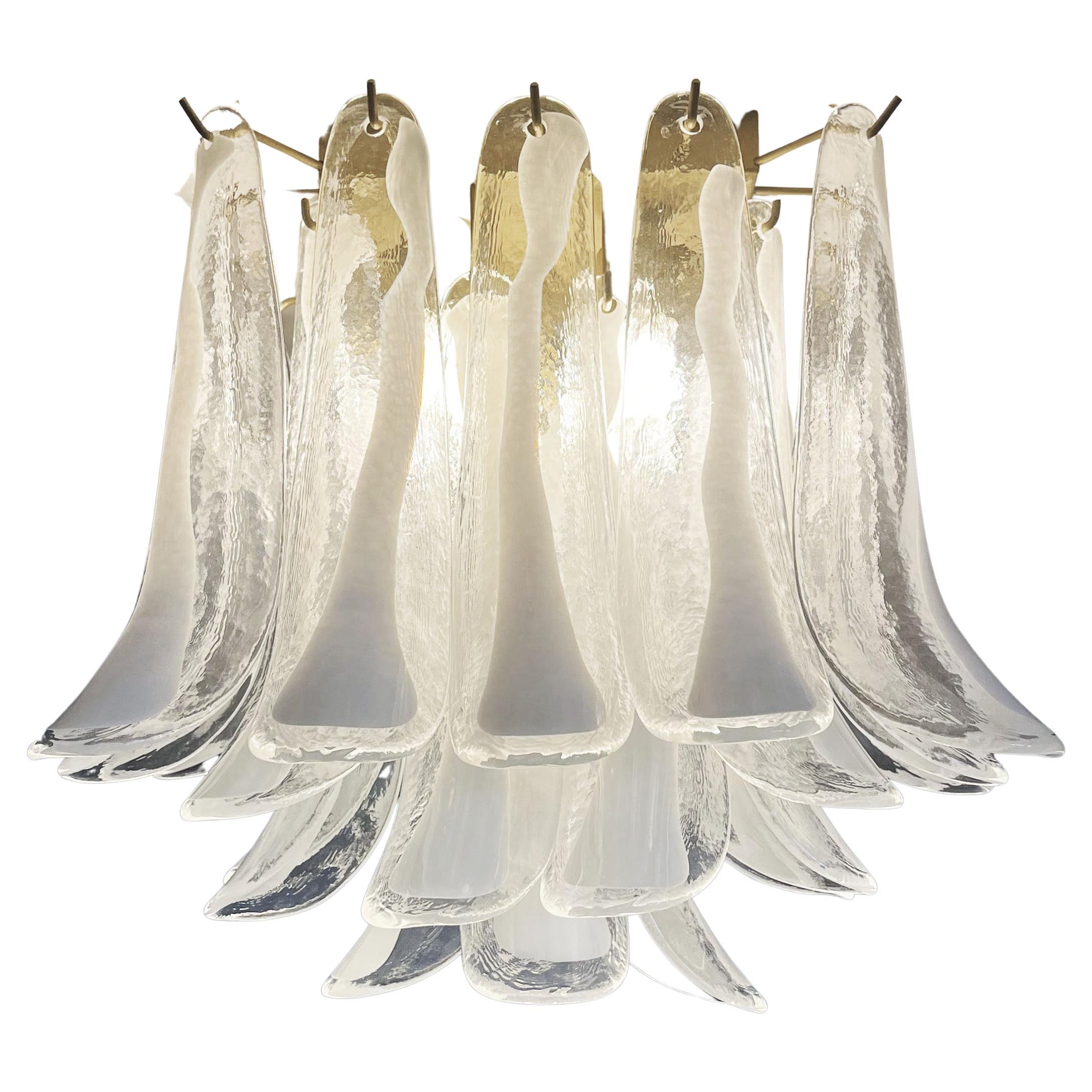 Spectacular ceiling lamp with 32 Murano lattimo glass petals (clear with white lattimo spot) in golden painted metal frame. Elegant lighting object.
Period: late XX century
Dimensions: 19,20 inchs (50 cm) height; 19,20 inches (50 cm) width; 19,20