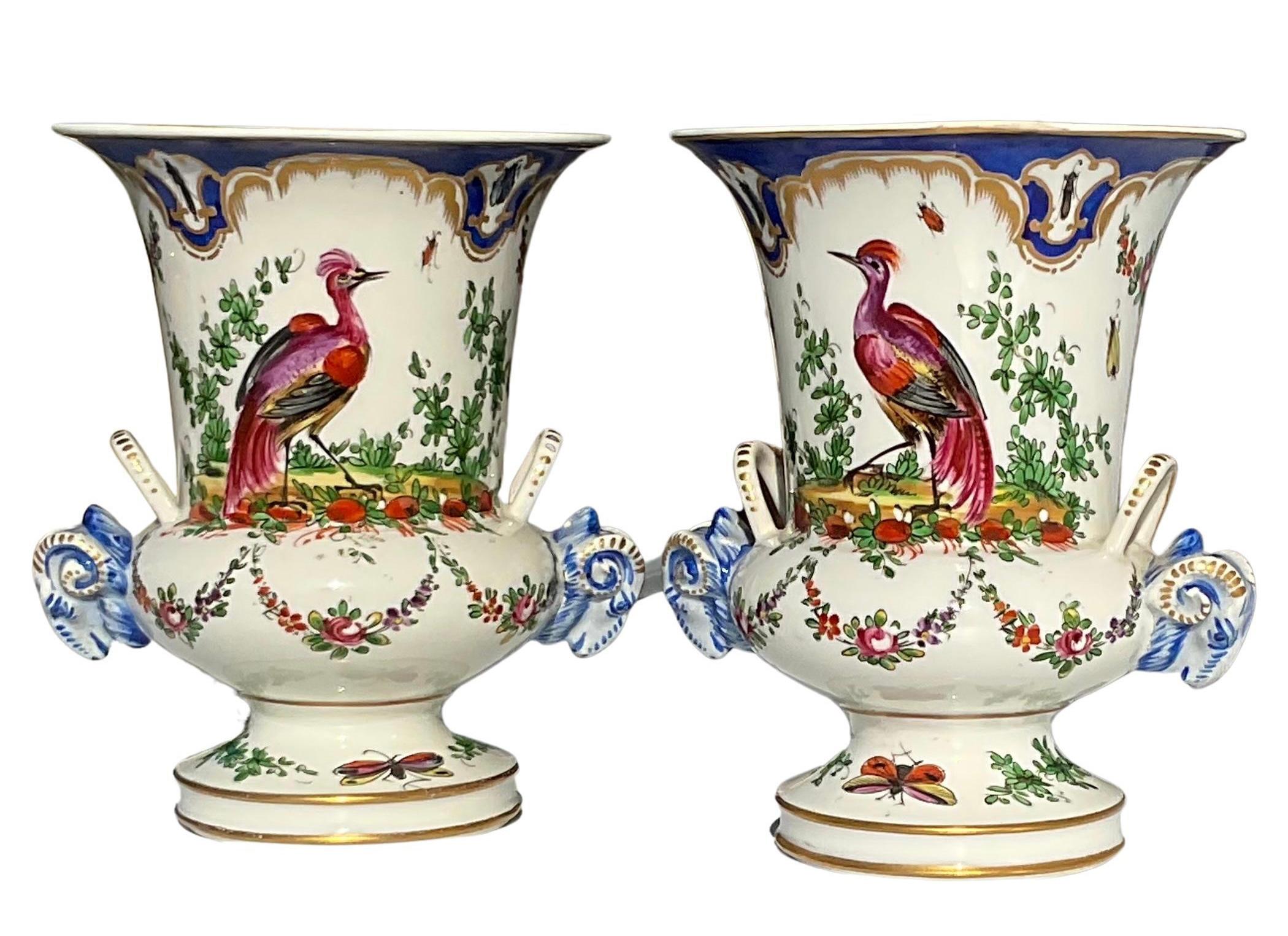 Pair Chelsea Porcelain pair decorative bird vases with rams head handles circa 1760’s. Both signed with the gold Anchor mark.