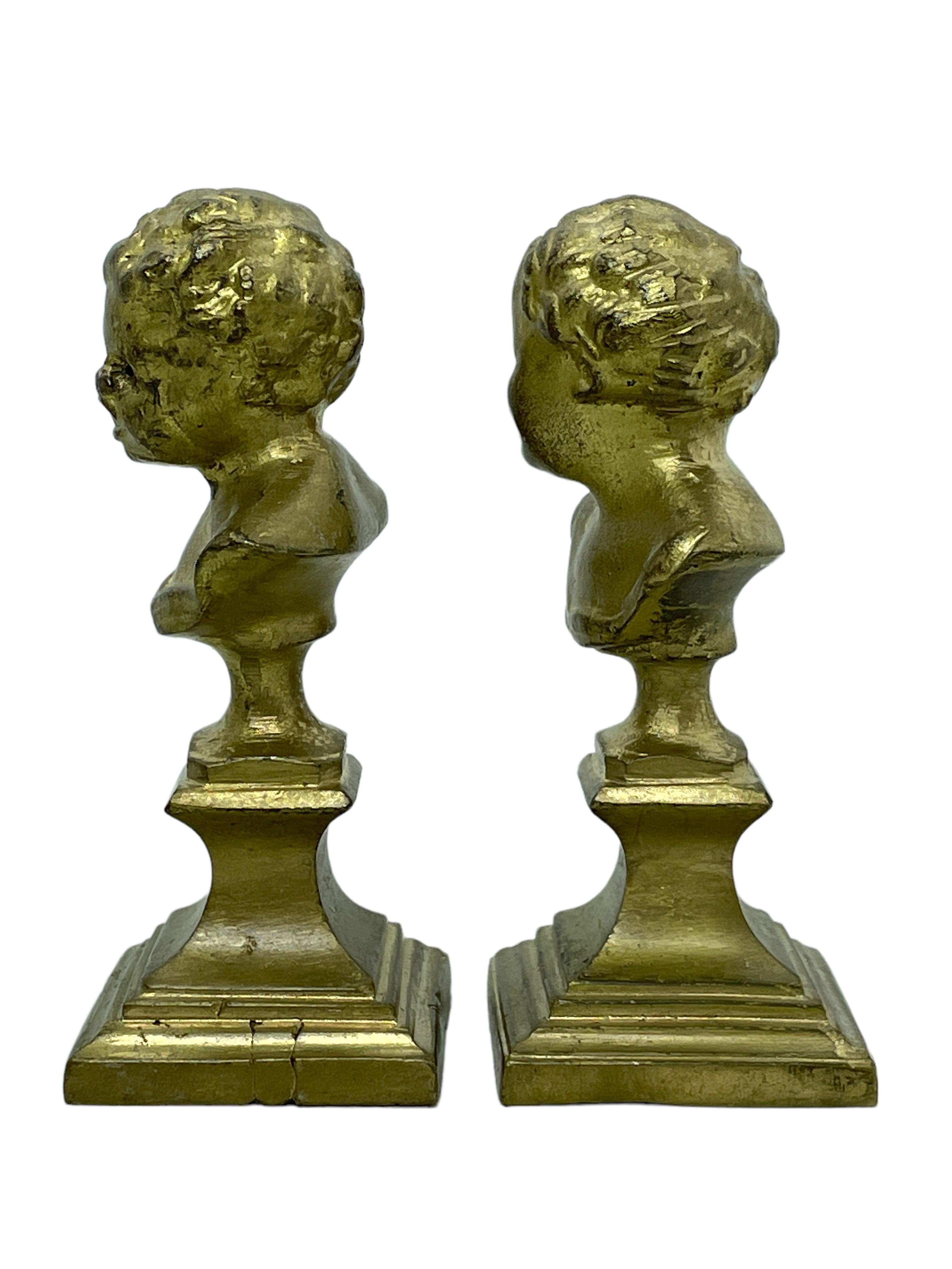 A pair of classic decorative Bust statues. Some wear with a nice patina, but this is old-age. Made of a kind of metal, we think its gilded bronze. Very decorative and nice to display in your collection of miniatures or any room.