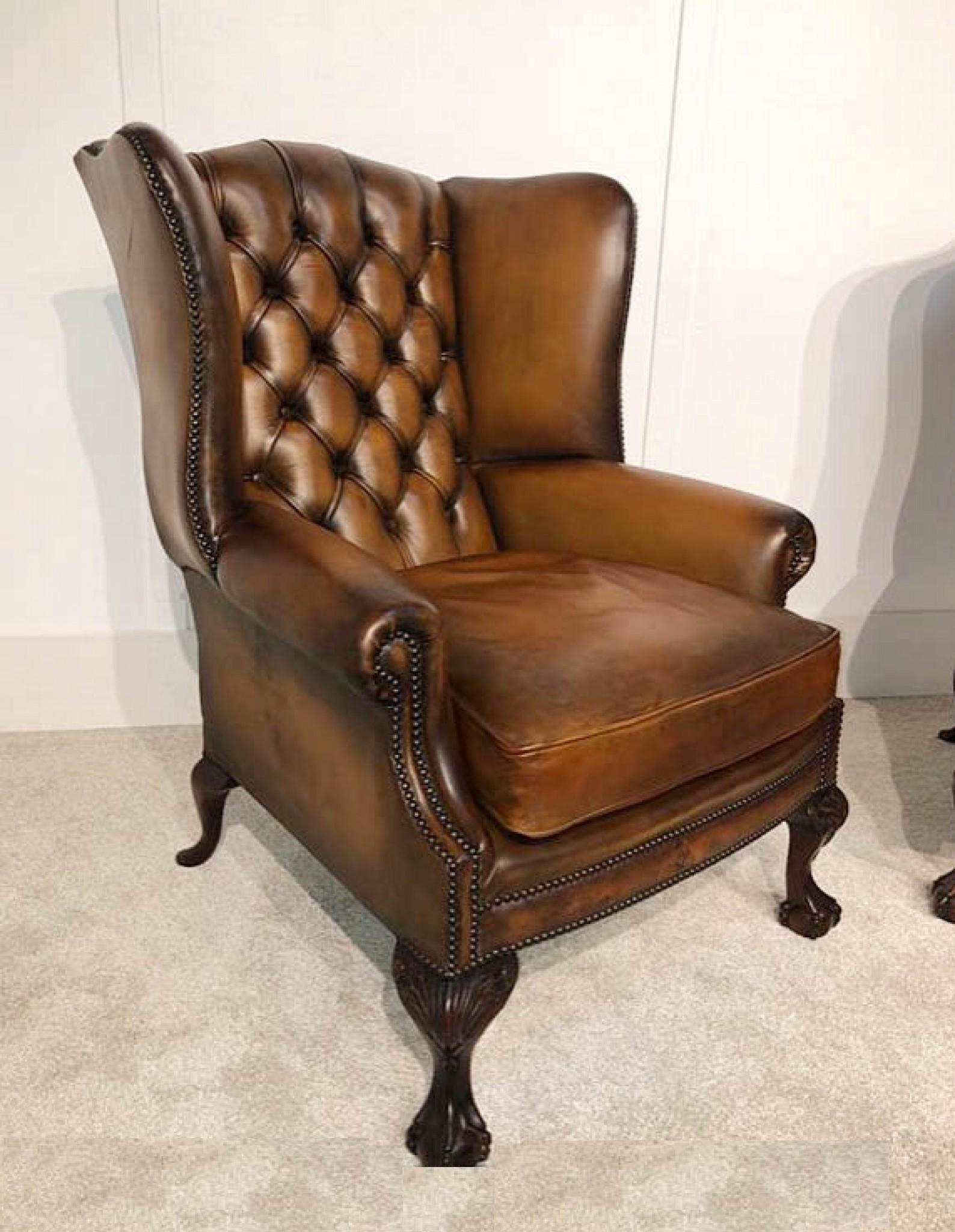 Stunning pair of Victorian style leather wingback chairs
Also referred to as Chesterfields
Perfect gentlemans club look - very comfortable with deep button leather
Hand carved ball and claw feet
Offered in great shape and can ship to anywhere in the