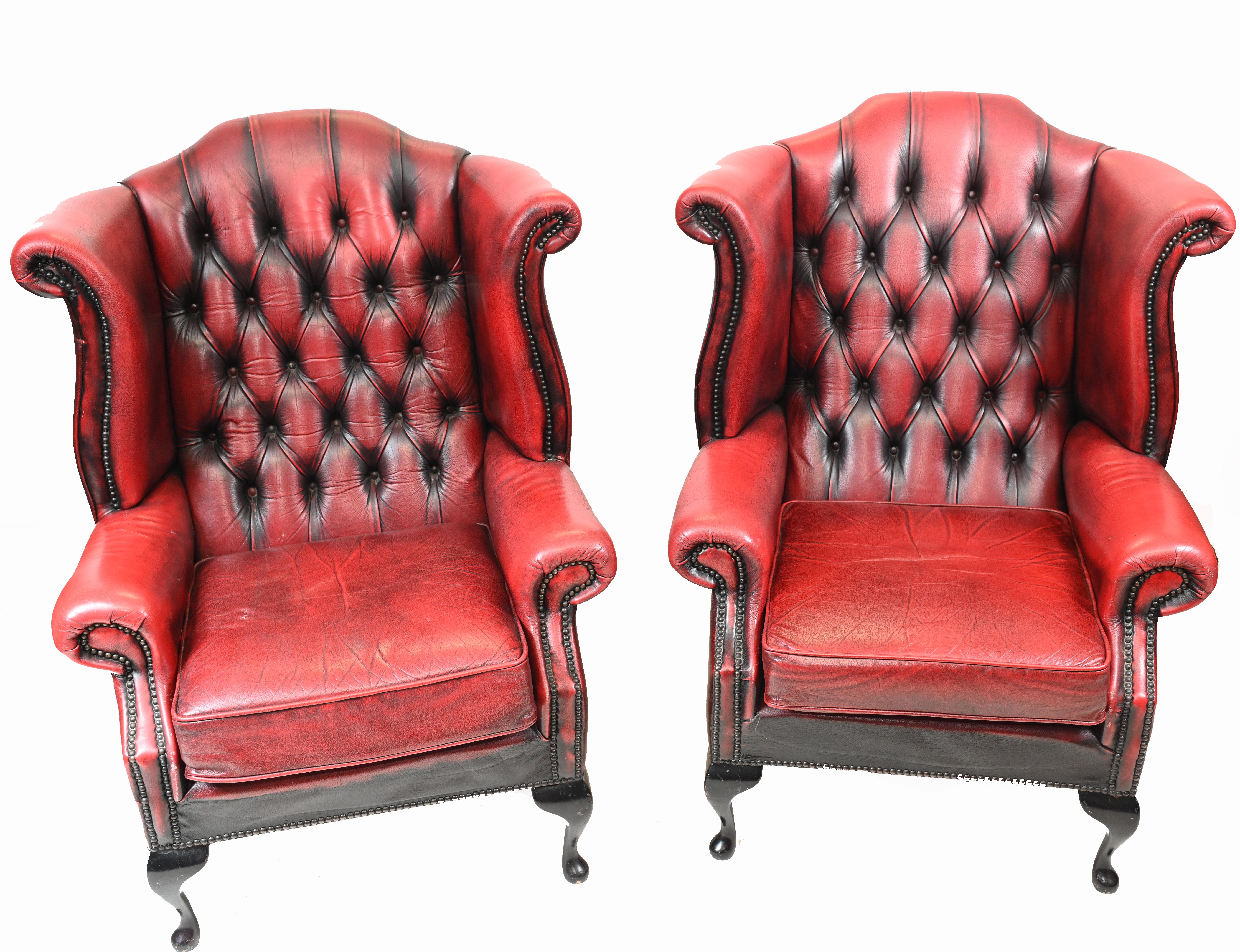 Elegant pair of leather Chesterfield wingback arm chairs
Classic deep button finish to the back 
Very comfortable to sit in, you can really sink back into these
Red leather with antiqued finish
Bought from a dealer on Church Street London