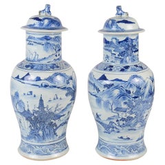 Vintage Pair Chinese 19th Century Blue and White lidded vases.