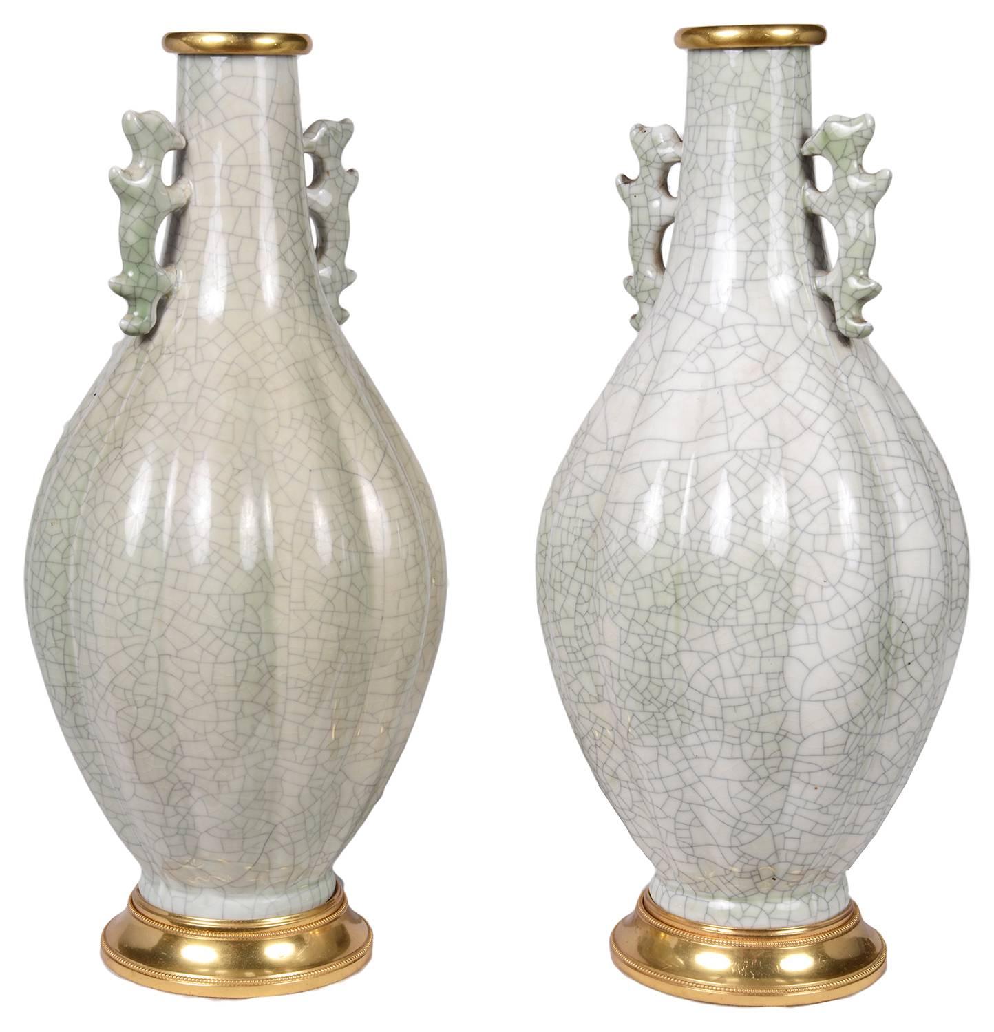 A stylish pair of Chinese 19th century crackle ware vases / lamps, each with fretted handles and gilded ormolu bases and rims.
We can convert to lamps if required.
G7560/15 CEKZ