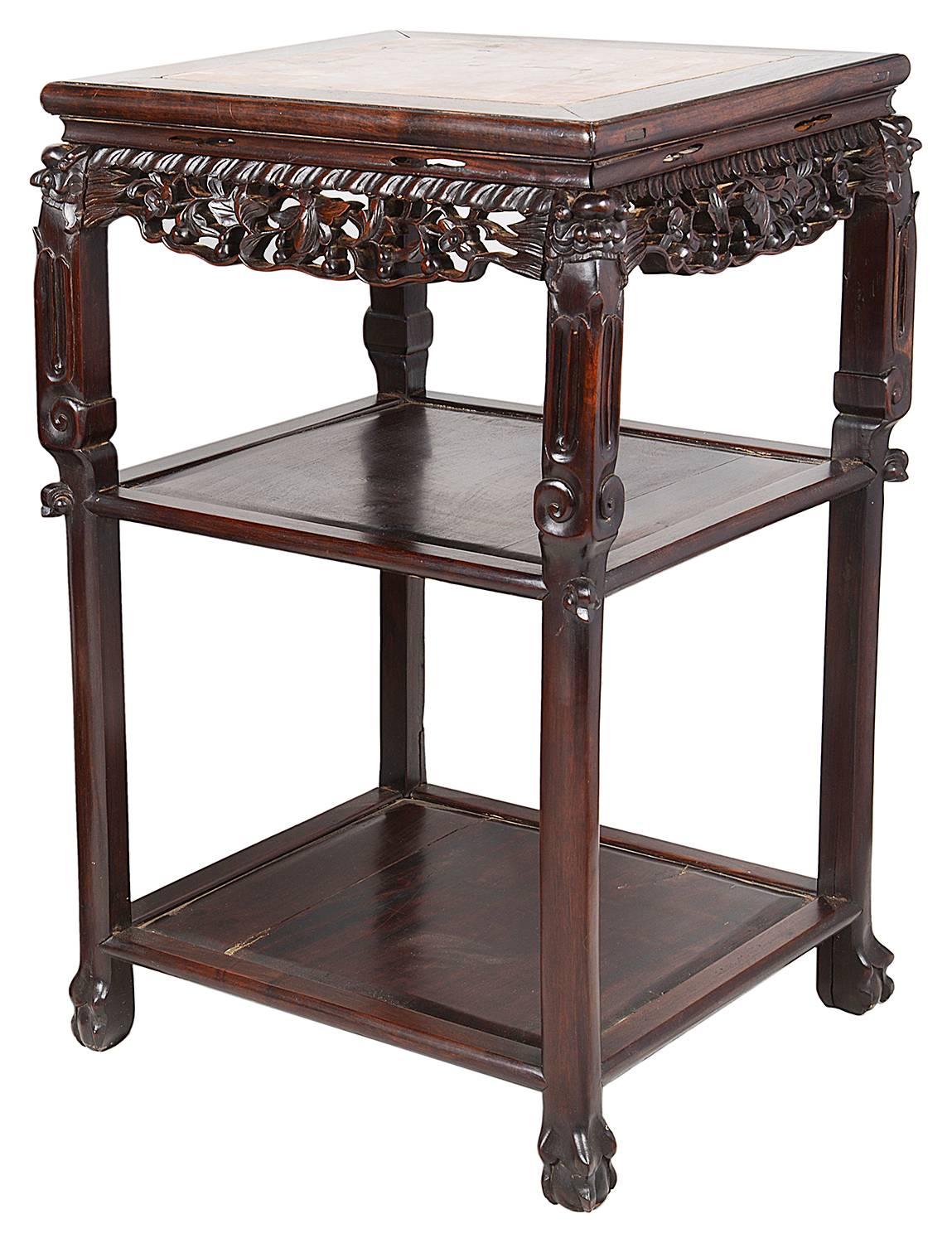 A good quality pair of 19th century Chinese hardwood stands. Each having inset marble tops, carved grape vines to the frieze, two shelves beneath and raised on carved legs, terminating in claw feet.