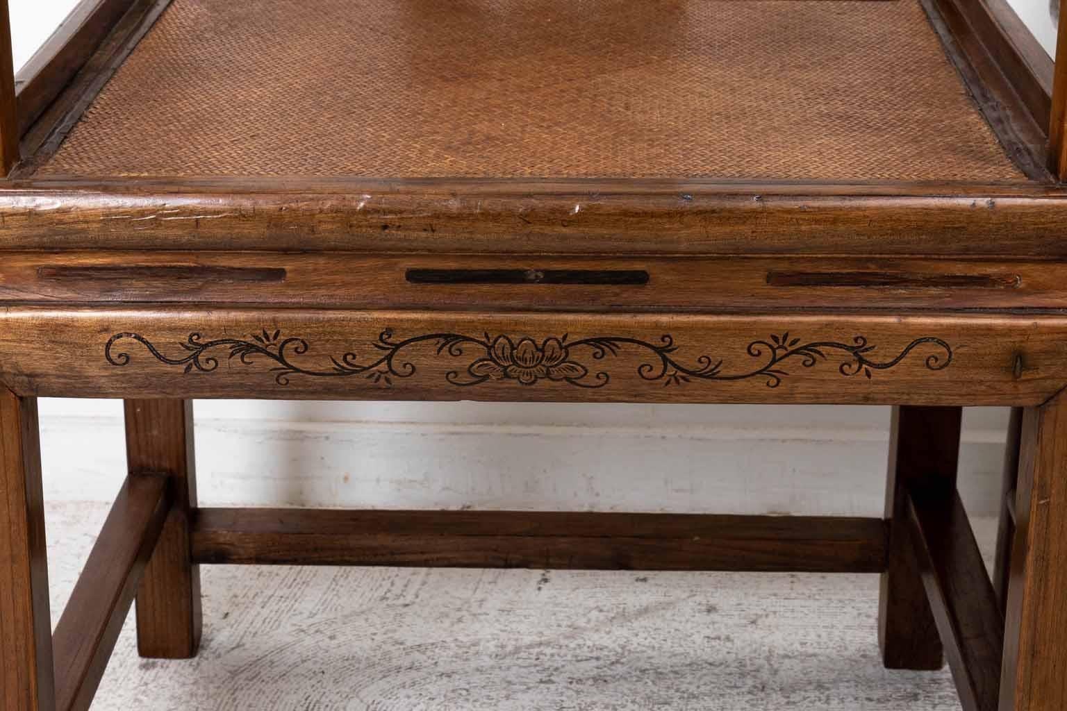 Pair Chinese Arm Chairs with woven seats. Pegged construction. Some wear from age and use