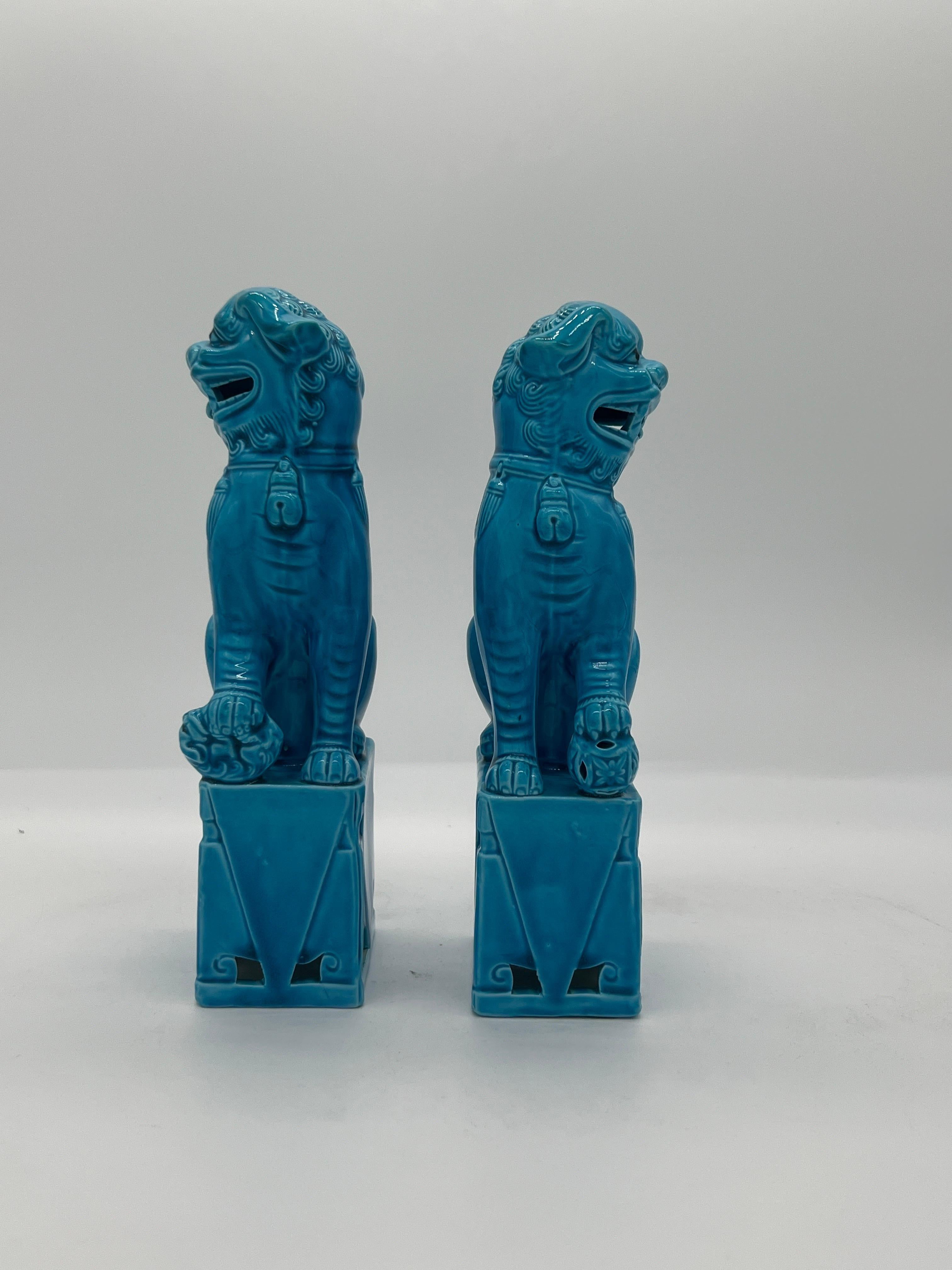 Chinese, mid century. 

A pair of turquoise blue ceramic foo dog sculptures, likely circa 1950 or 60.