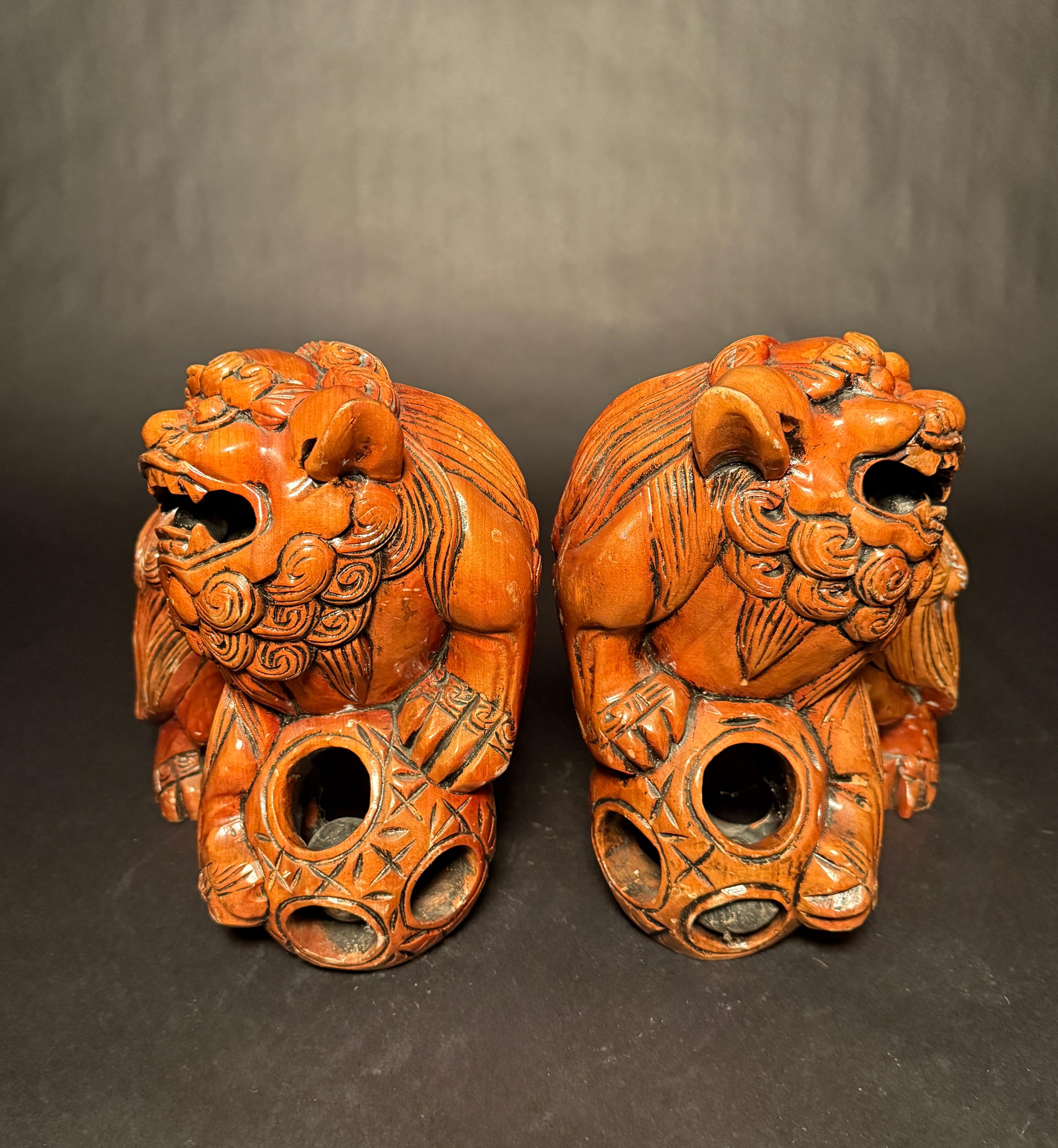 Hand-Carved Pair Chinese Carved Hardwood Foo dogs with Rolling Pearls & Puzzle Balls For Sale