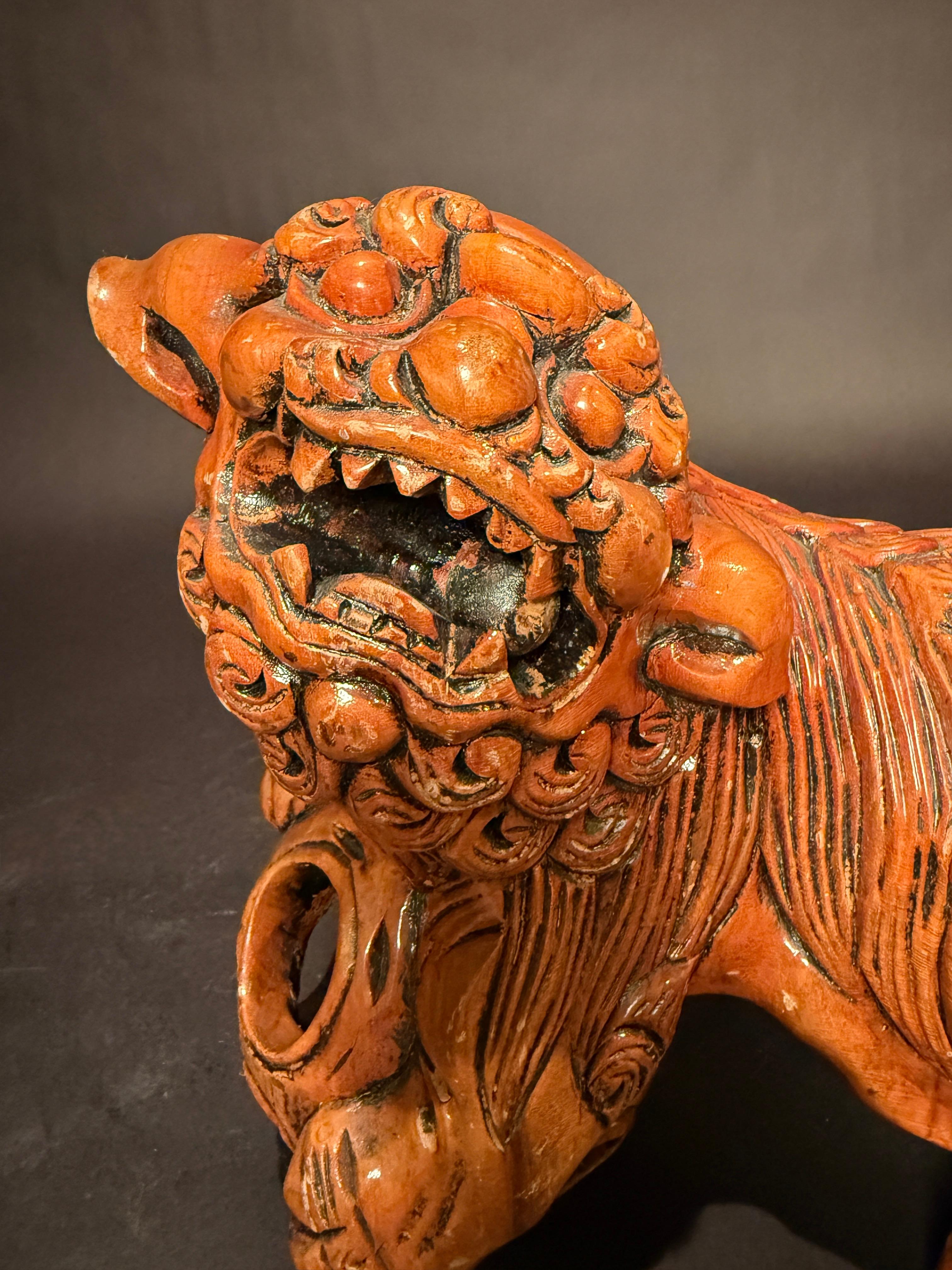Pair Chinese Carved Hardwood Foo dogs with Rolling Pearls & Puzzle Balls In Good Condition For Sale In Norwood, NJ