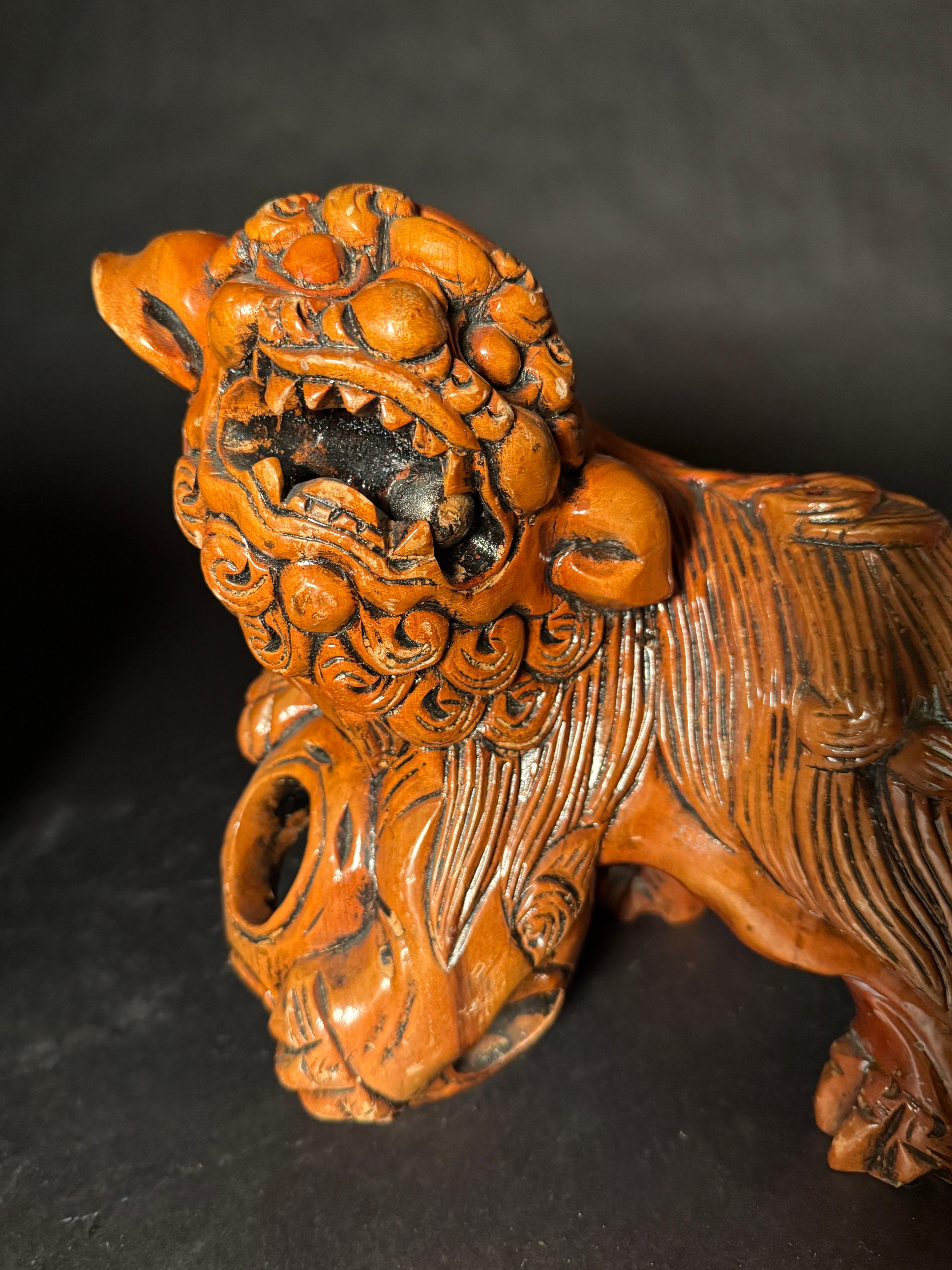 20th Century Pair Chinese Carved Hardwood Foo dogs with Rolling Pearls & Puzzle Balls For Sale