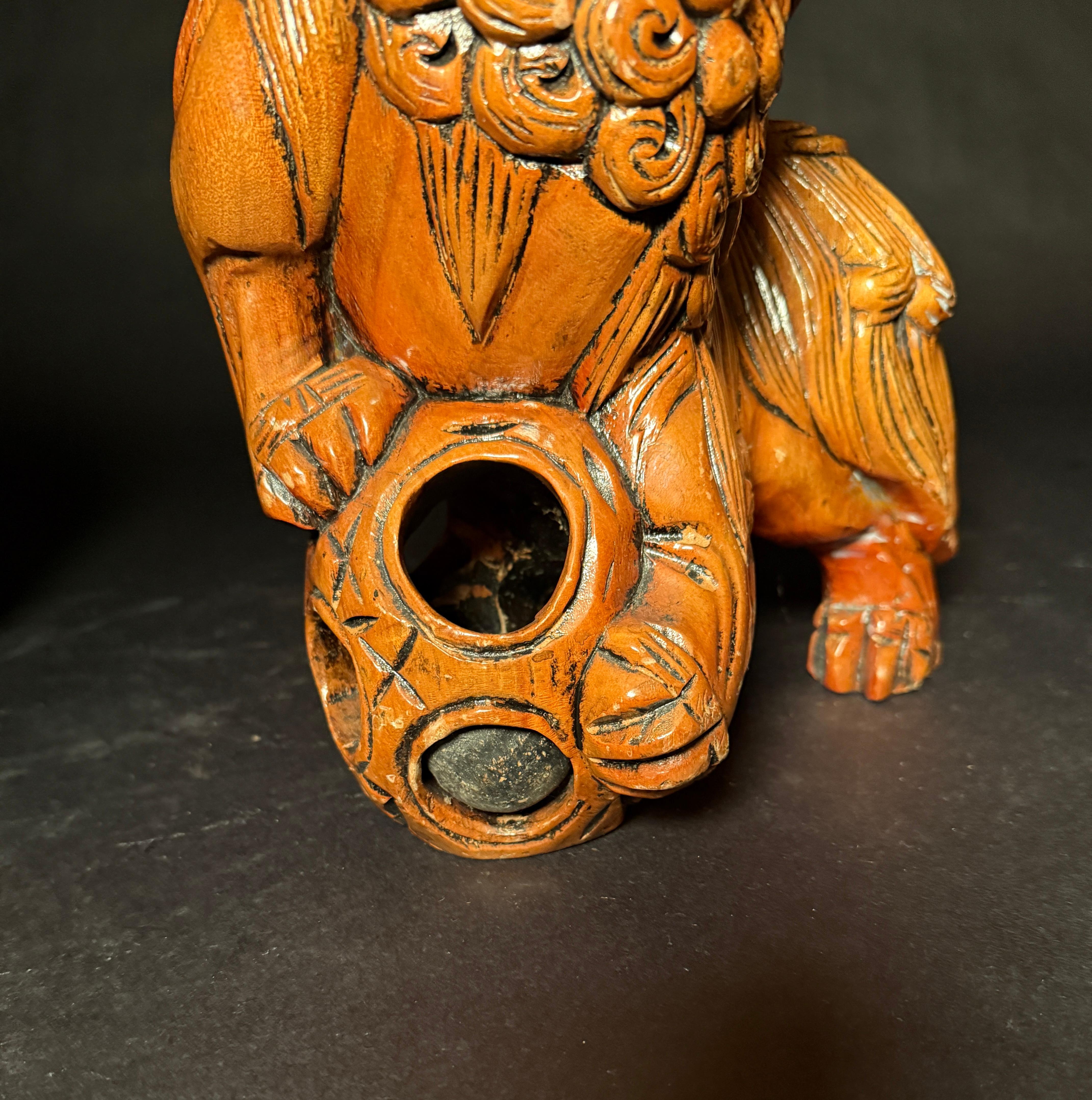 Pair Chinese Carved Hardwood Foo dogs with Rolling Pearls & Puzzle Balls For Sale 1