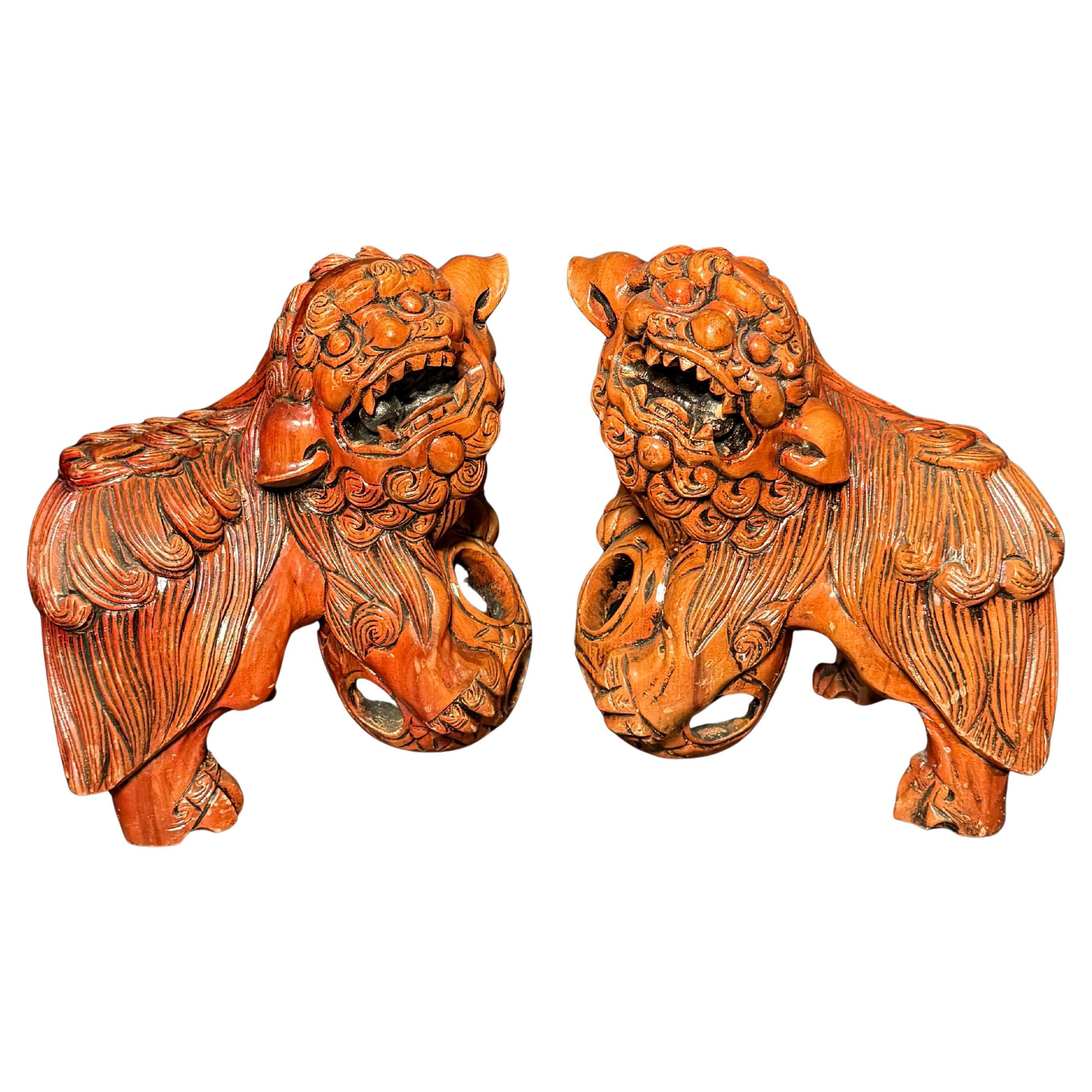 Pair Chinese Carved Hardwood Foo dogs with Rolling Pearls & Puzzle Balls