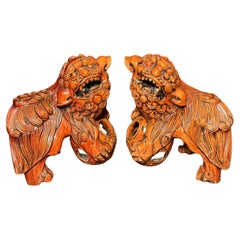 Pair Chinese Carved Hardwood Foo dogs with Rolling Pearls & Puzzle Balls