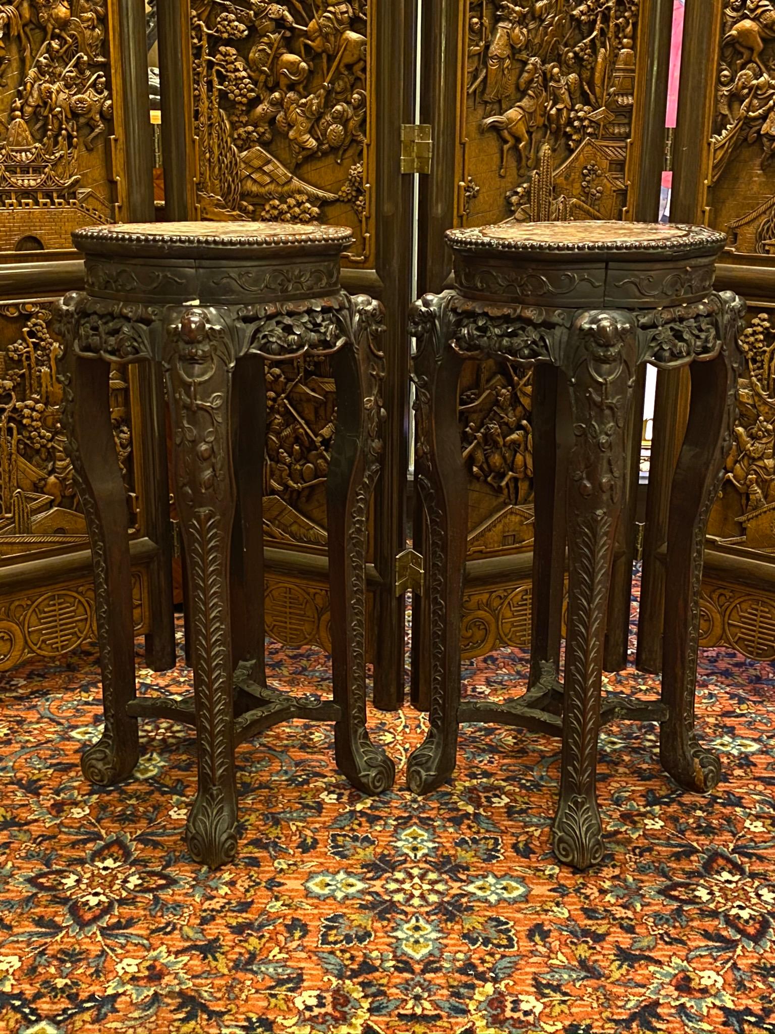 Pair of large Chinese carved teak wood and marble pedestals.