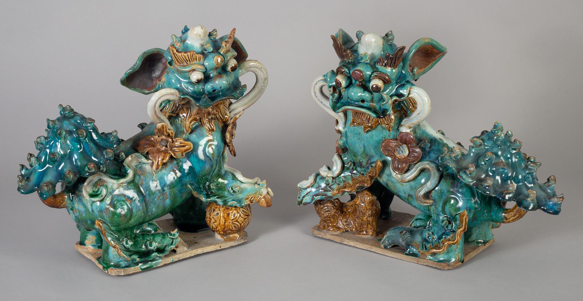Chinese Export Pair of Chinese Ceramic Buddhistic Lions For Sale