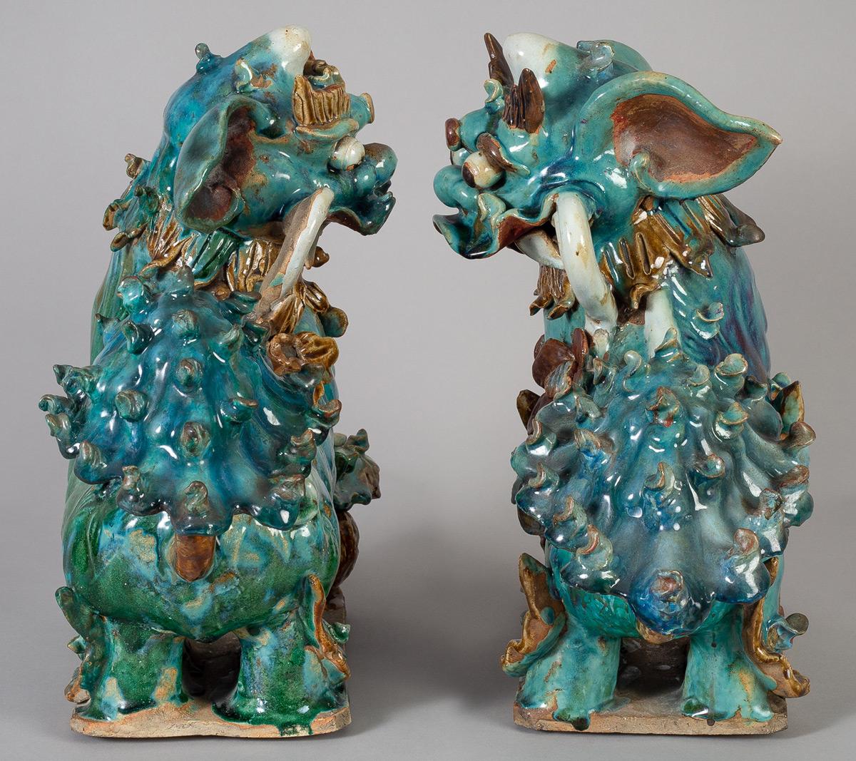 Glazed Pair of Chinese Ceramic Buddhistic Lions For Sale