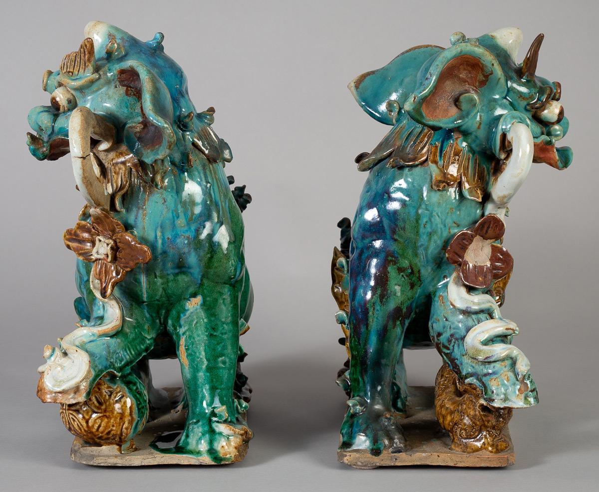 Pottery Pair of Chinese Ceramic Buddhistic Lions For Sale