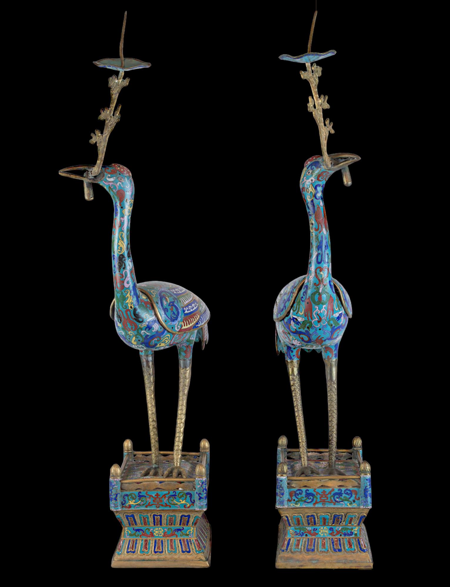 This darling pair of cloisonné crane pricket candlesticks would be the perfect addition to any home. In Chinese mythology the symbol of the crane represents longevity, and the depiction of two side by side are meant to project ultimate longevity.