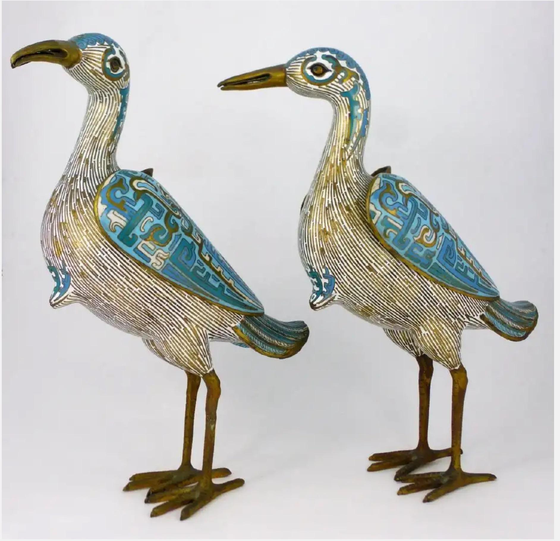 Gorgeous inspired large pair of Chinese cloisonné bird form vessels.
Lovely design and coloration make a lovely Connoisseur accent in any decor.
The wings can be removed to expose an opening, possibly to hold something secret and safe.
Measures: