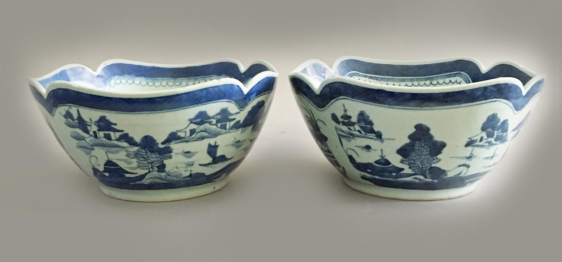 Pair of Chinese export porcelain blue and white square salad bowls with notched corners, decorated with pagodas, boats, mountains, rockery and trees. The interior of the bowl has a similar scene of pagodas in the center bottom with a wide blue