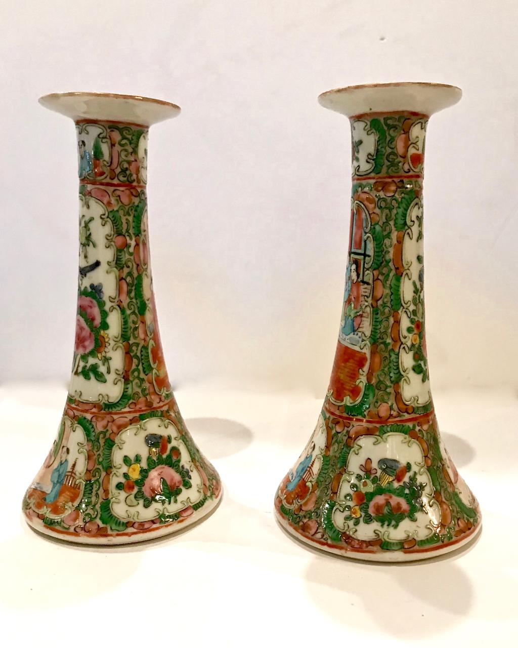 This is an iconic pair of mid-19th century Chinese Export Rose Canton candlesticks that date to circa 1860-1870. Both candlesticks are in very good condition with very minor rubbing to edges. Unmarked.