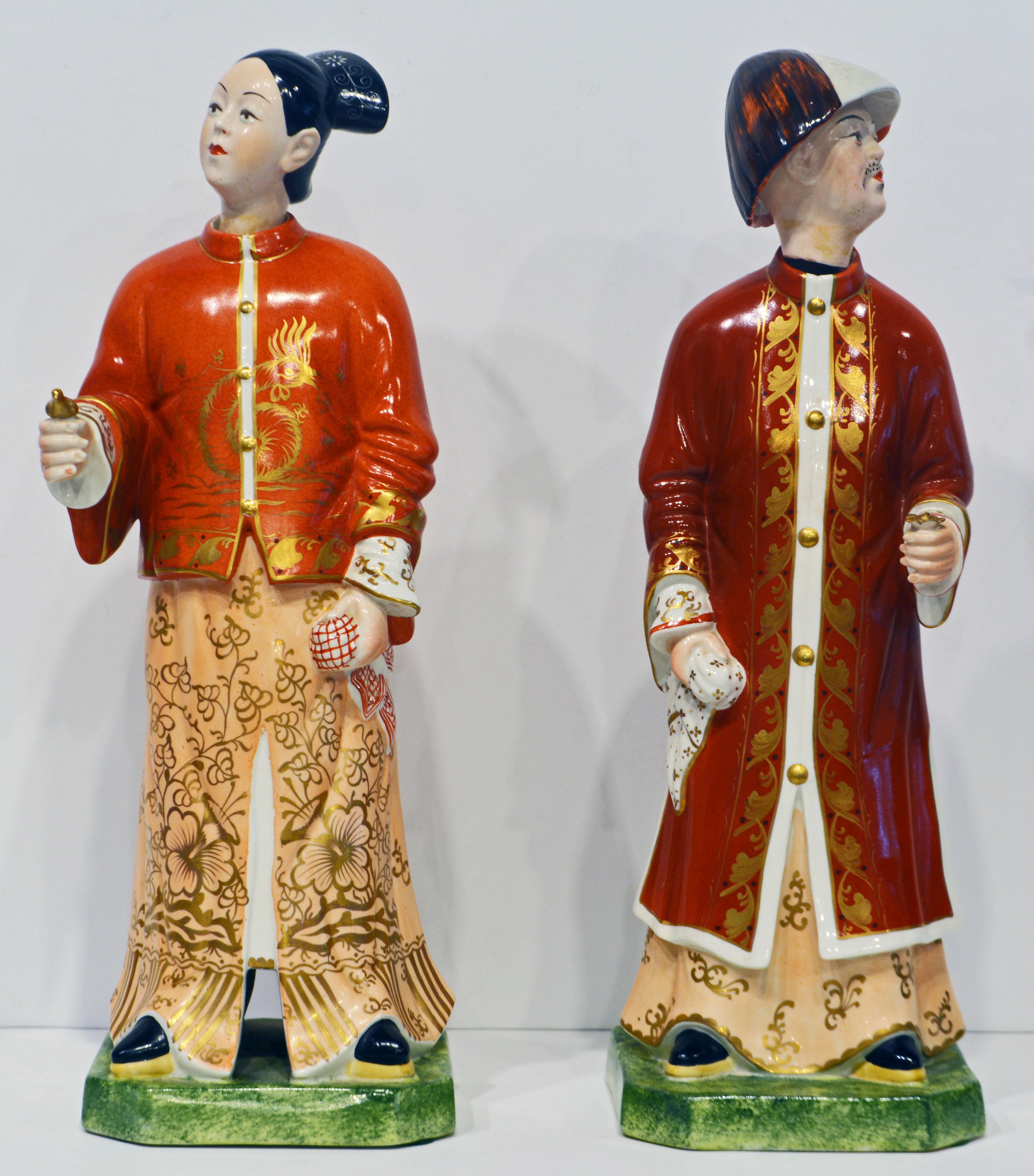 Each male and female figure shown standing in colorful robes on canted square plinths, the separate heads attached to weighted poles to facilitate movement. The porcelain figures feature great craftsmanship, rich color and a subtle surface.
        