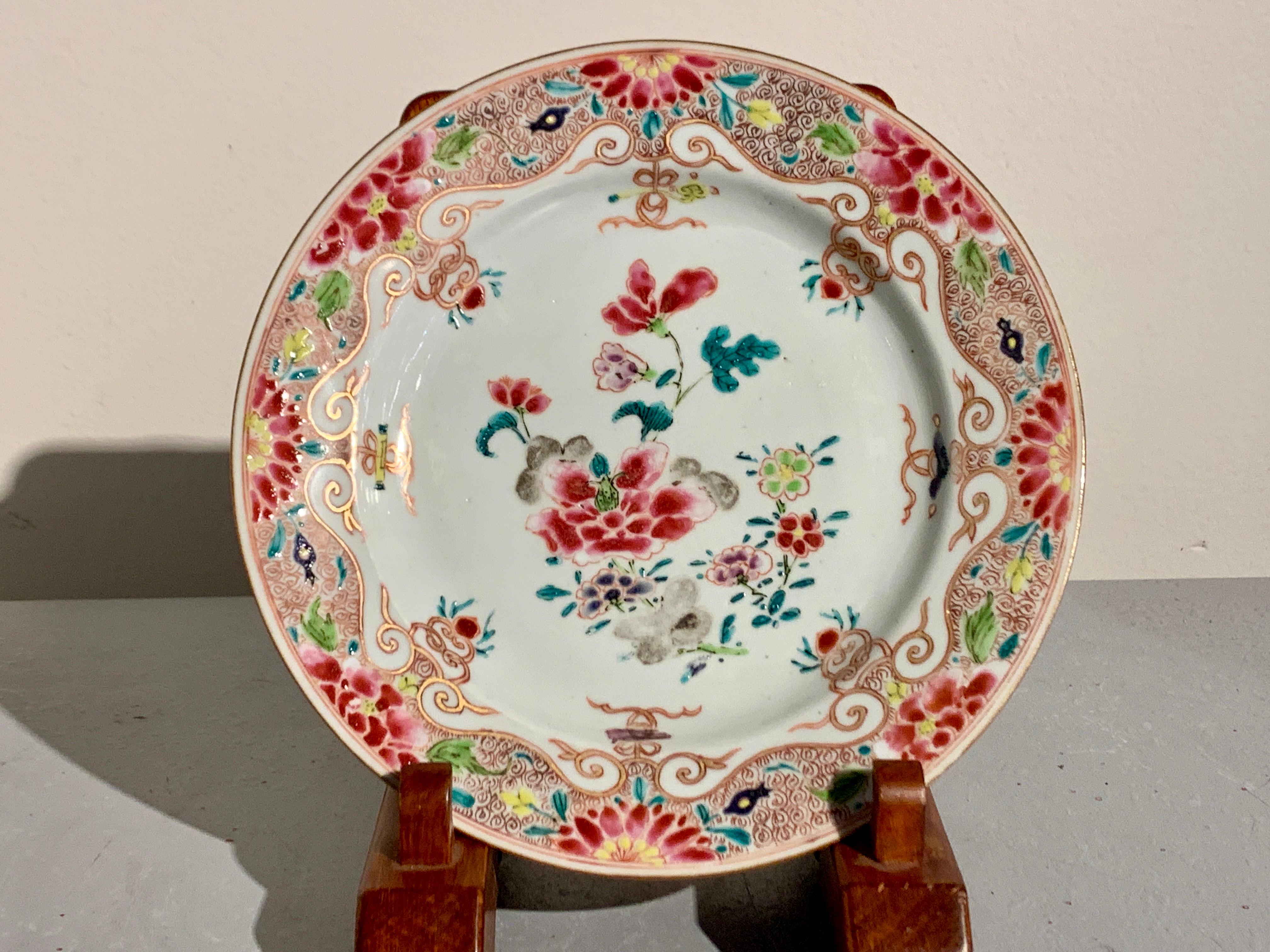 A gorgeous pair of 18th century Chinese Export porcelain plates decorated in stunning famille rose enamels, Yongzheng Period, circa 1730, China.

The small plates decorated in bright and bold famille rose enamels, with pink dominating the color