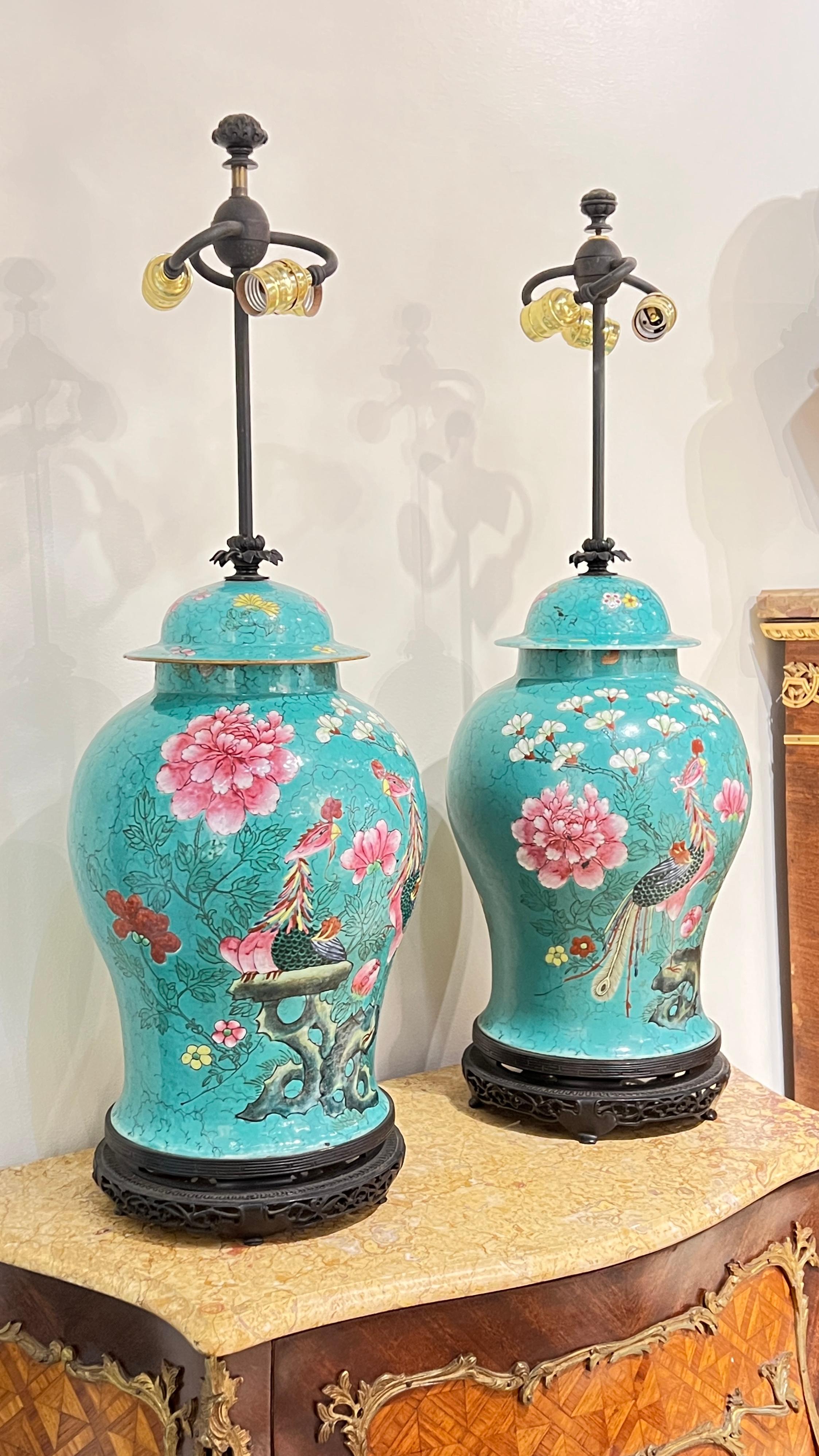 Pair of antique (early 20th century) table lamps crafted from Chinese porcelain urns in the Famille Rose style
Pair of Chinese famillie rose table lamps. All original patinated bronze.
 bases and hardware Attributed to Caldwell
Stock number: L416.