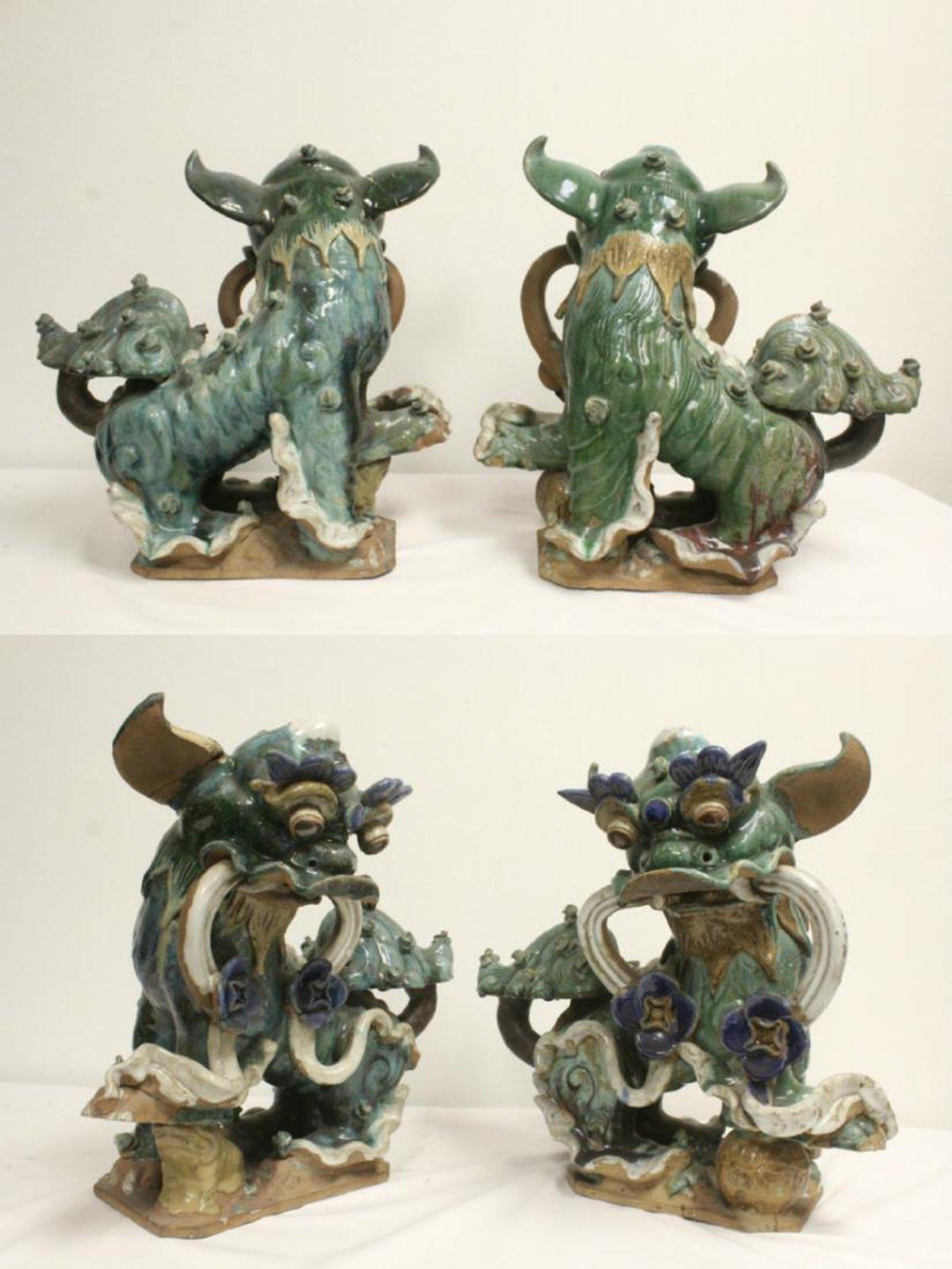 Imposing pair of Chinese glazed pottery Fu Lions, first half of the 20th century.
Beautifully painted with green, blue and white partially glazed. They both have an intriguing mystical look.

Base dimensions: 7 inches x 10 inches
The Fu Lion