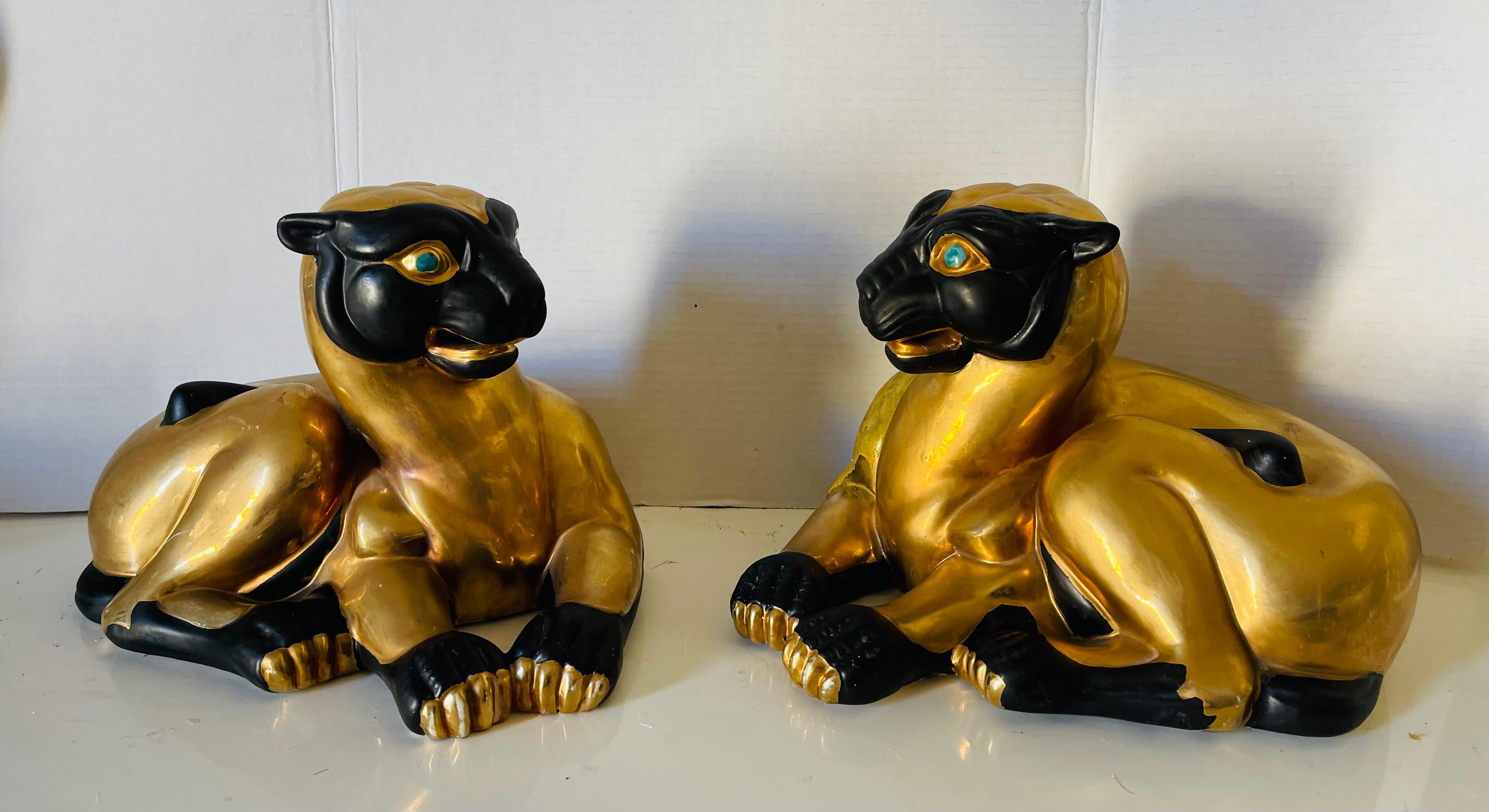  Impressive antique  Asian pair of sphinx Bastet goddess of women sculptures. Cat like figurines with gold bodies, black enamel heads with turquoise enamel eyes. Porcelain made bear stamps of Macao. Unique elegant art sculptures. 