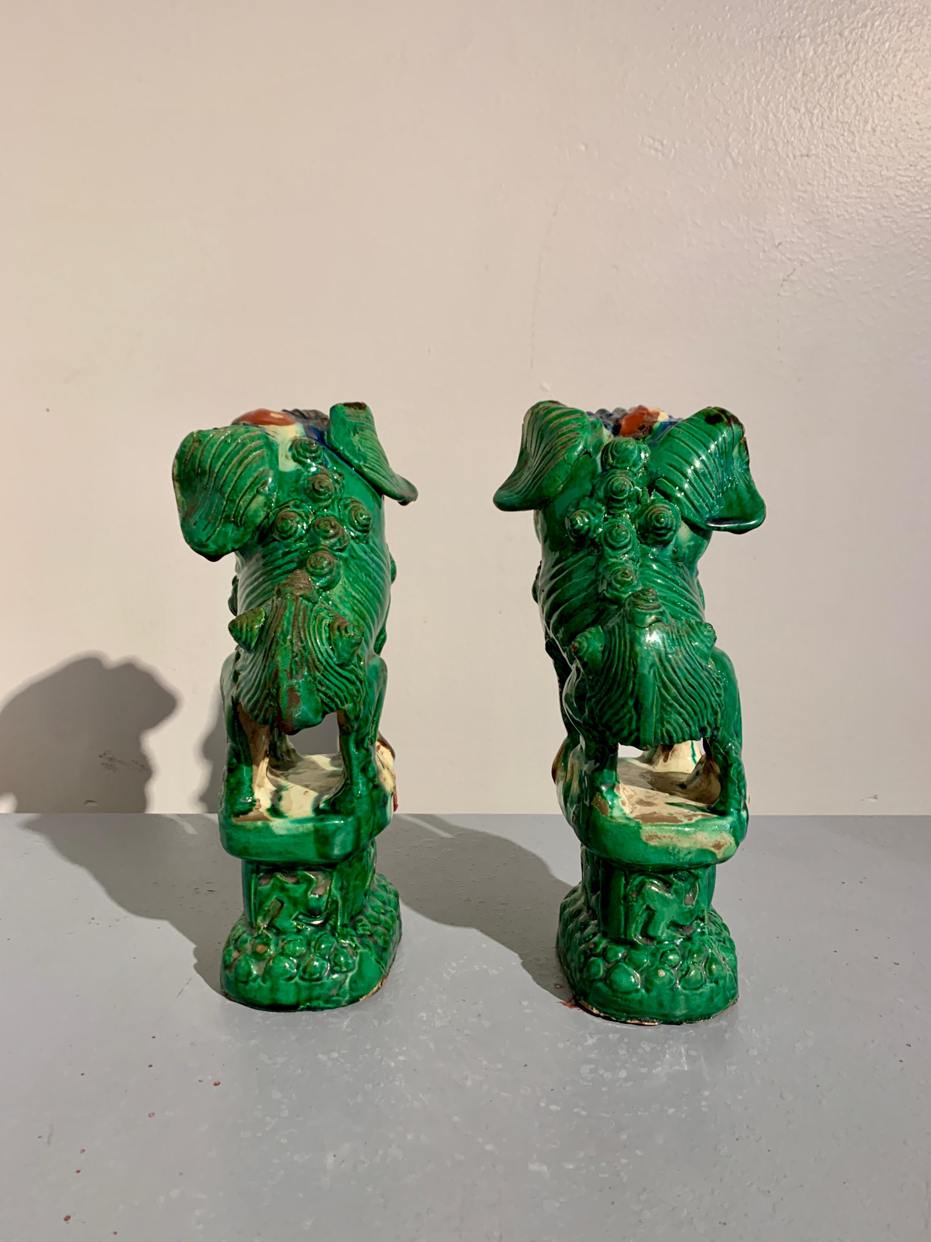 Stoneware Pair Chinese Green Glazed Foo Dogs, Qing Dynasty, circa 1900, China