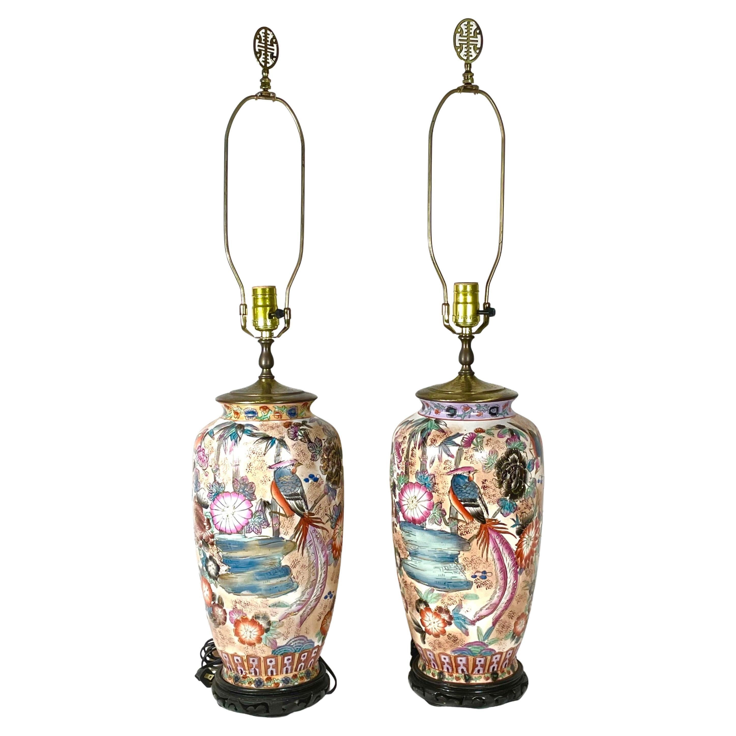 Pair Chinese hand painted porcelain and gilt decorated pheonix motif lamps.

Two large, heavy polychrome Chinese vases with auspicious decorations of Phoenixes encircling peonies among water and branches on a white background. The Ornately