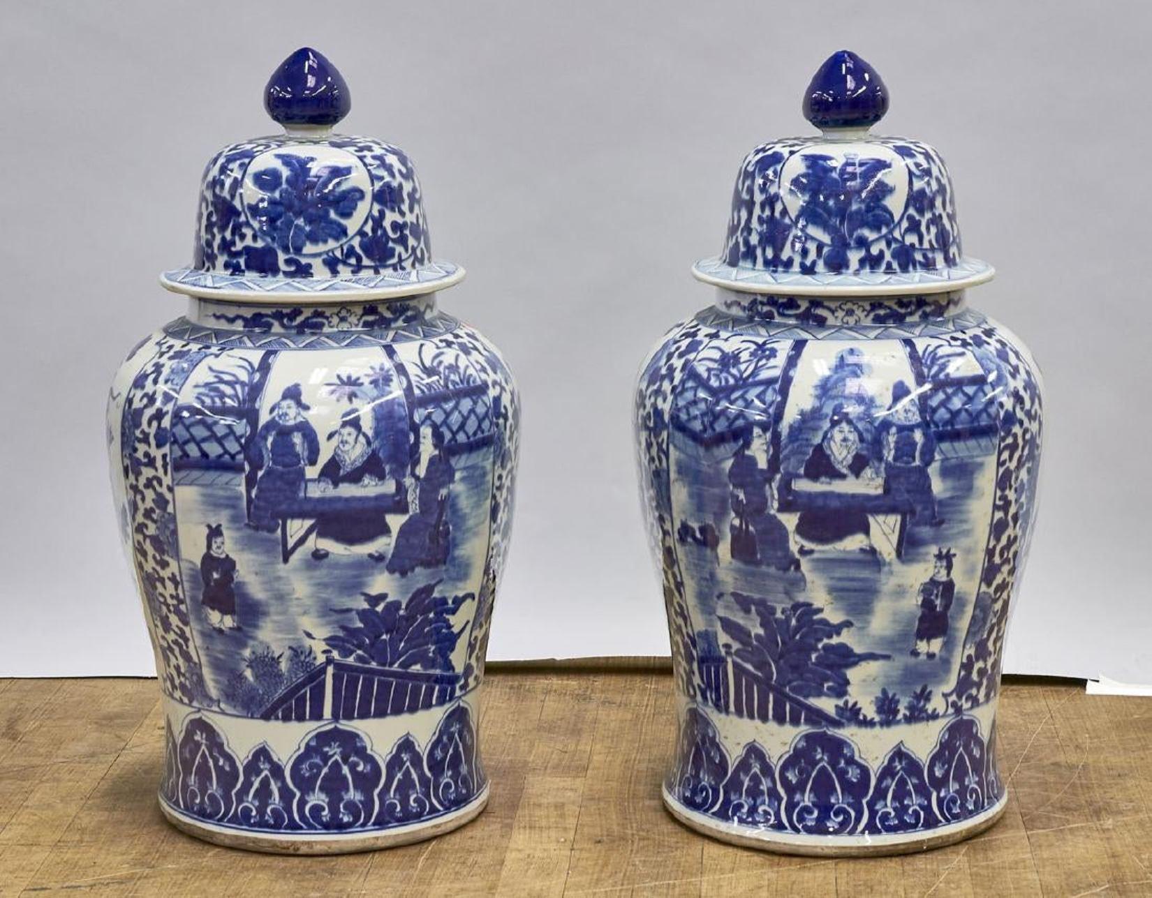 Impressive large pair of Chinese Kangxi style blue and white painted porcelain ginger jars with seated scholar and assistance observing a child. The back depicting dragons in the clouds. 

