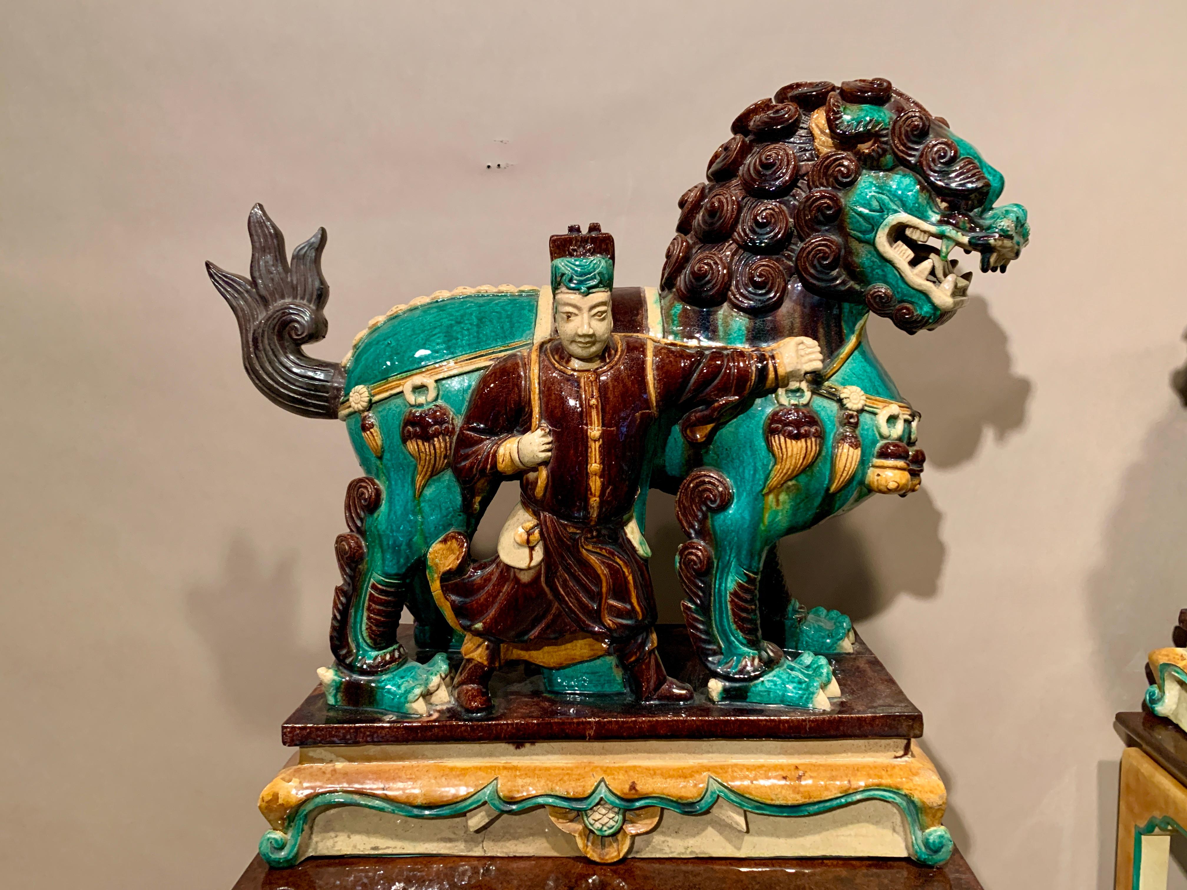 Pair Chinese Ming Dynasty Glazed Buddhist Lions and Attendants, 17th Century In Good Condition For Sale In Austin, TX