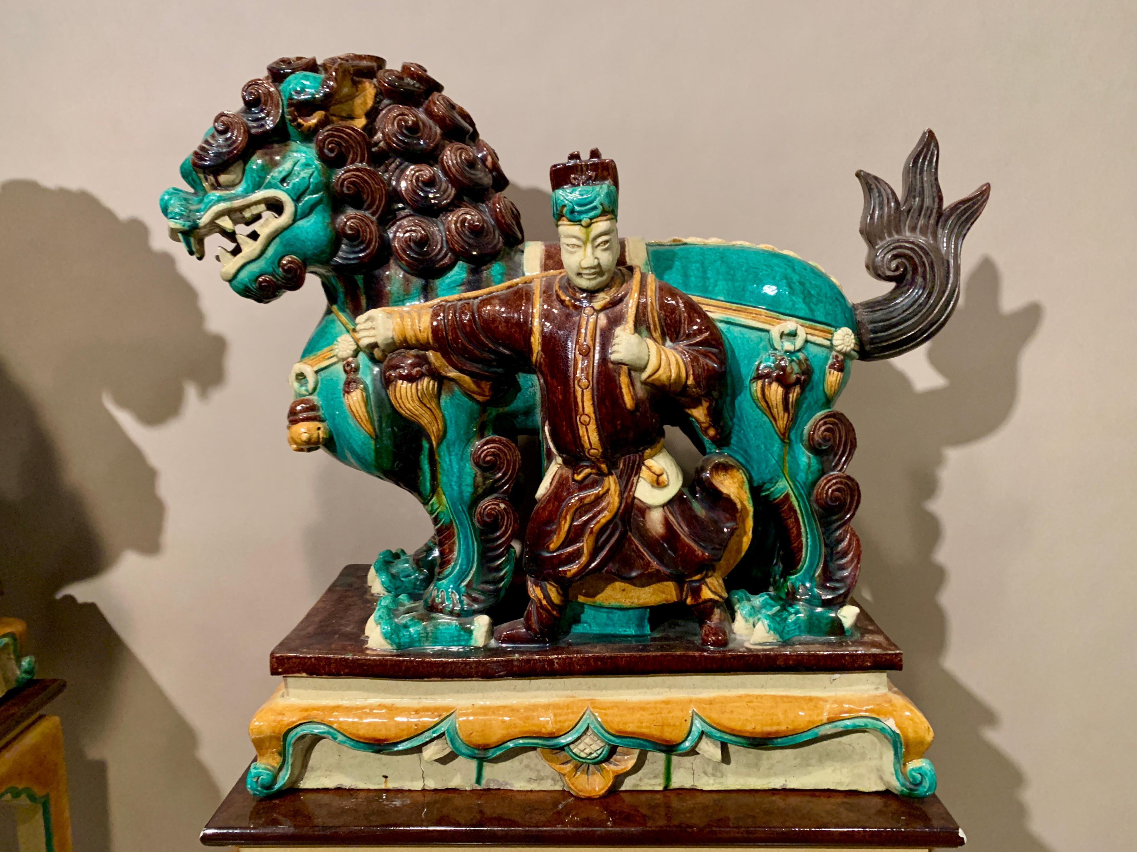 Ceramic Pair Chinese Ming Dynasty Glazed Buddhist Lions and Attendants, 17th Century For Sale