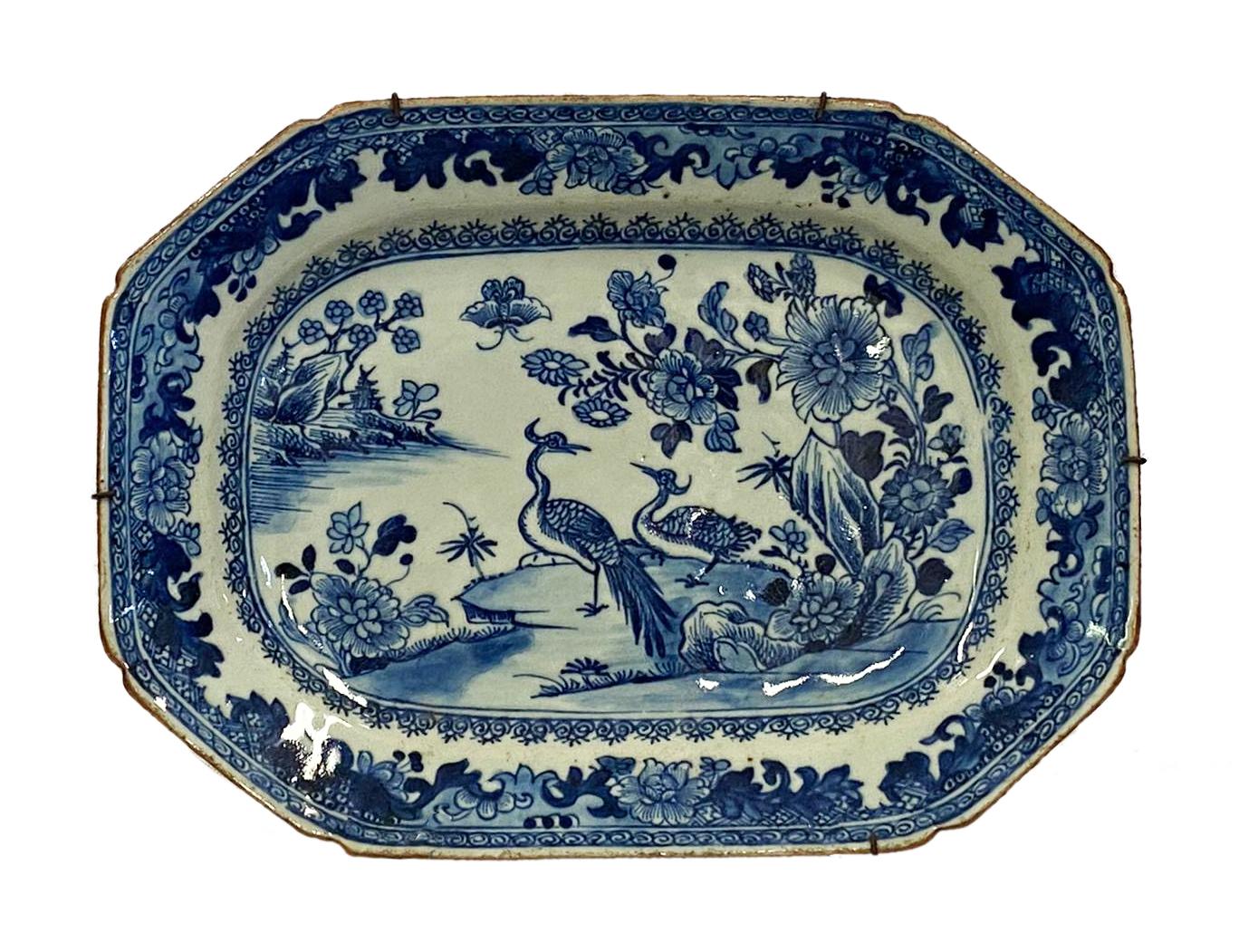 A good quality pair of late 18th century Chinese blue and white Nanking platers, each with wonderful blue ground, depicting classical scenes of exotic birds and flowers by the side of a lake, boarders to each plate with scrolling foliate decoration.