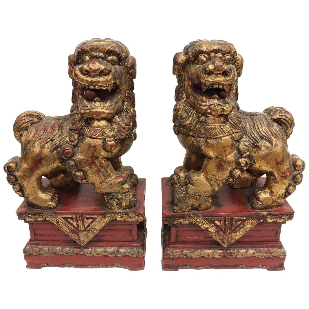 Pair of Chinese Parcel-Gilt Red Foo Lions