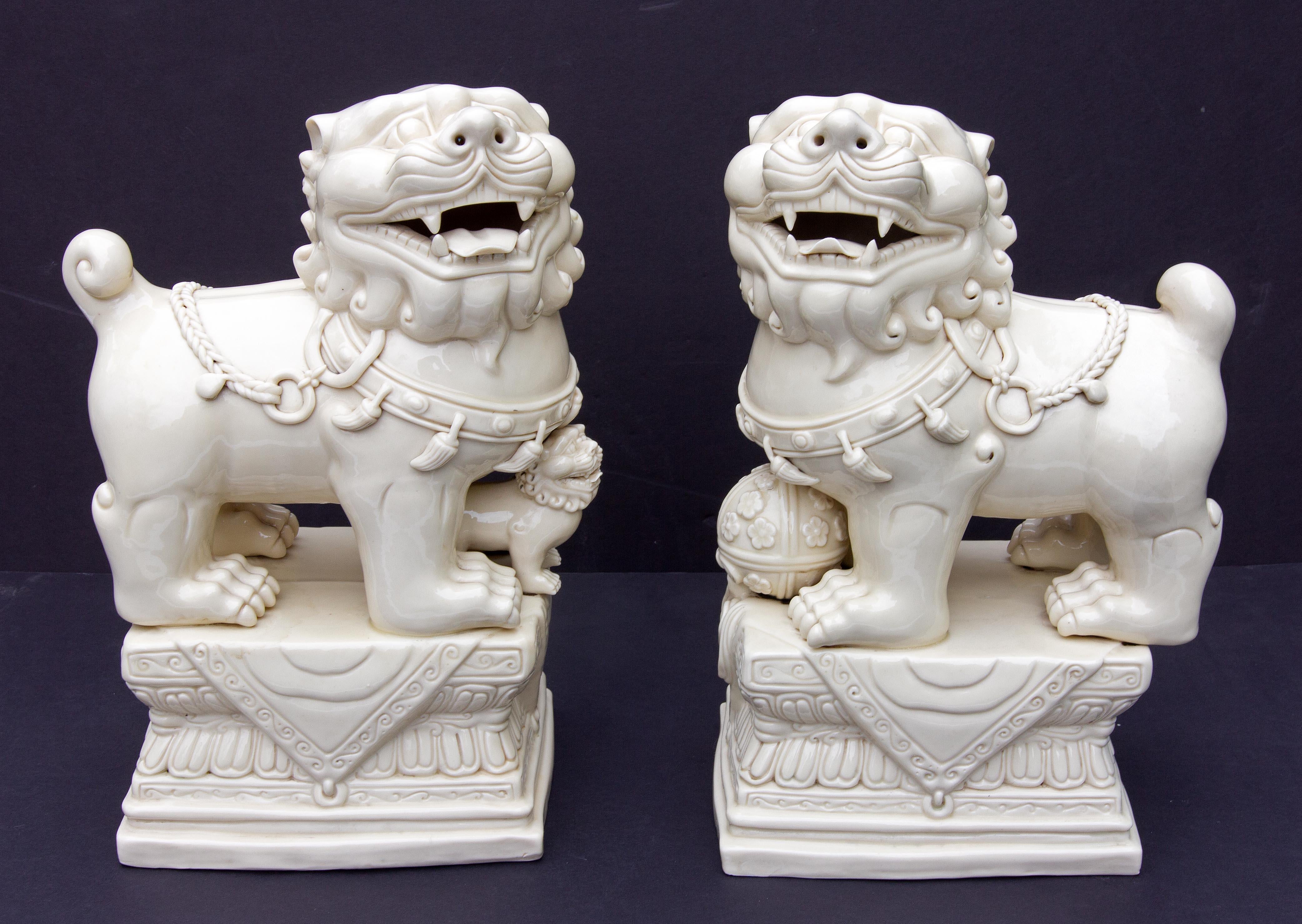 Pair of Chinese porcelain foo dogs. Exceptional quality. Mid 20th century. Possibly early 20th century. With impressed mark for He Chaozong. 



















Buddha Buddhist.