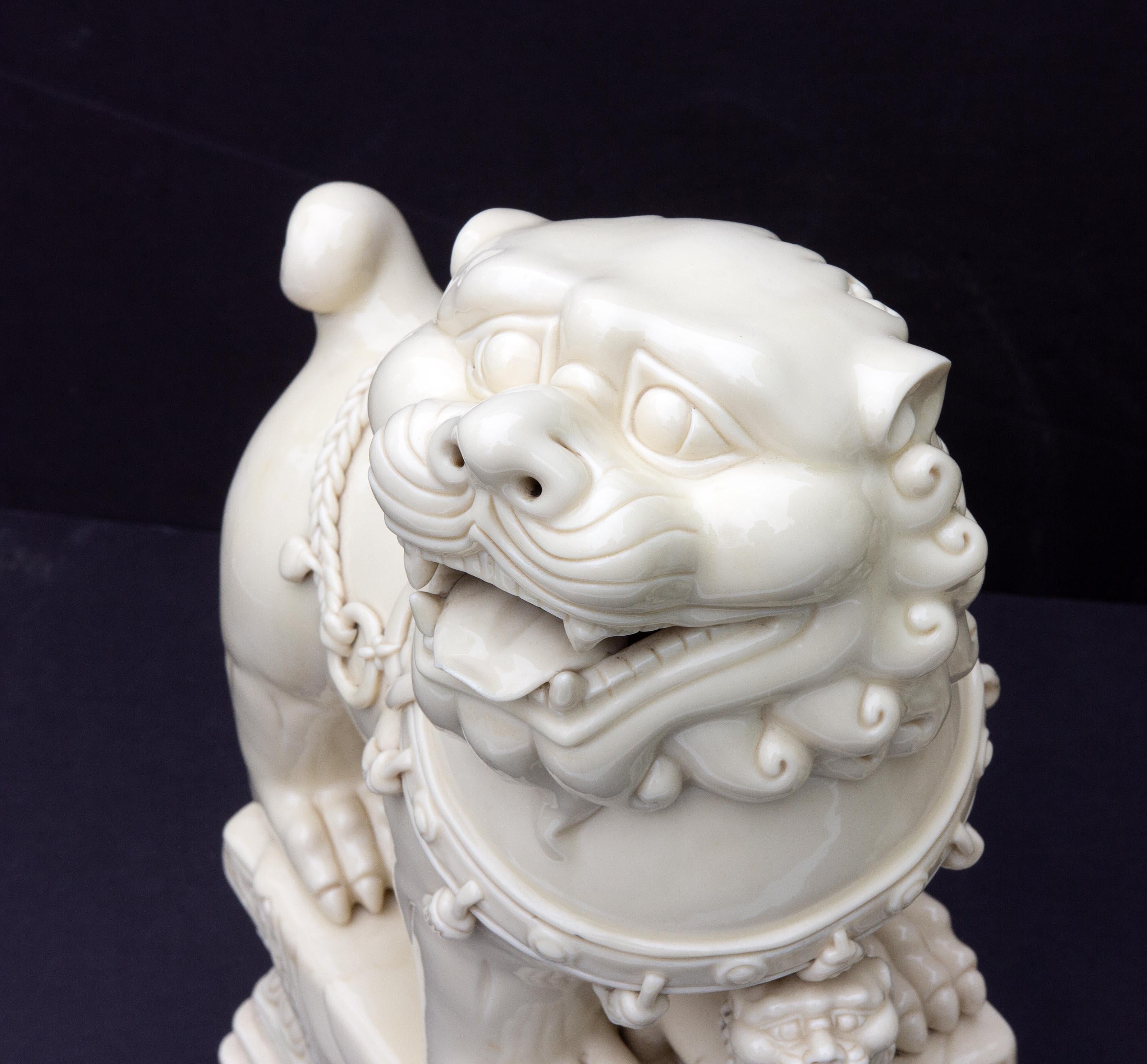 white ceramic foo dogs