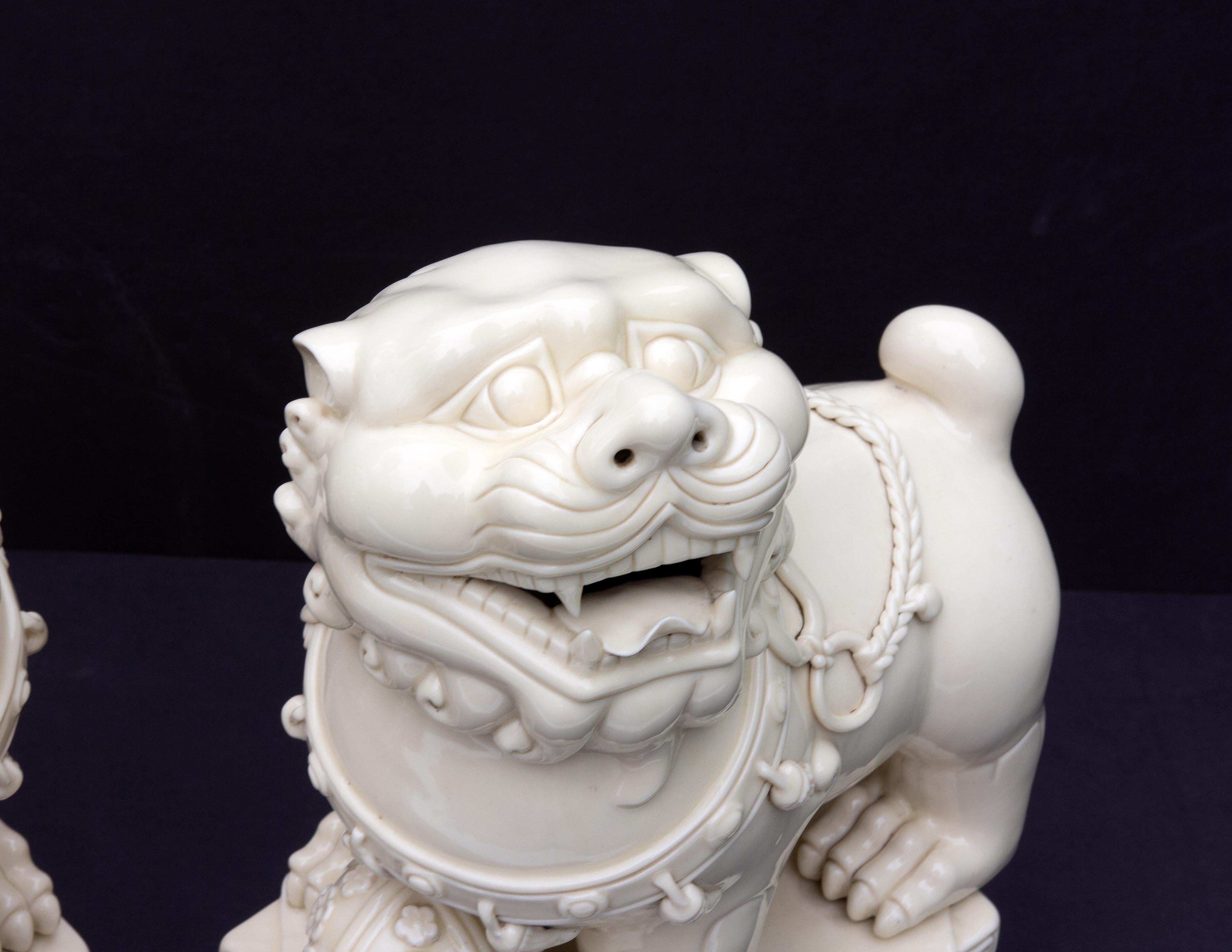 Glazed Pair Chinese Porcelain Dehua Blanc de Chine Foo Dogs