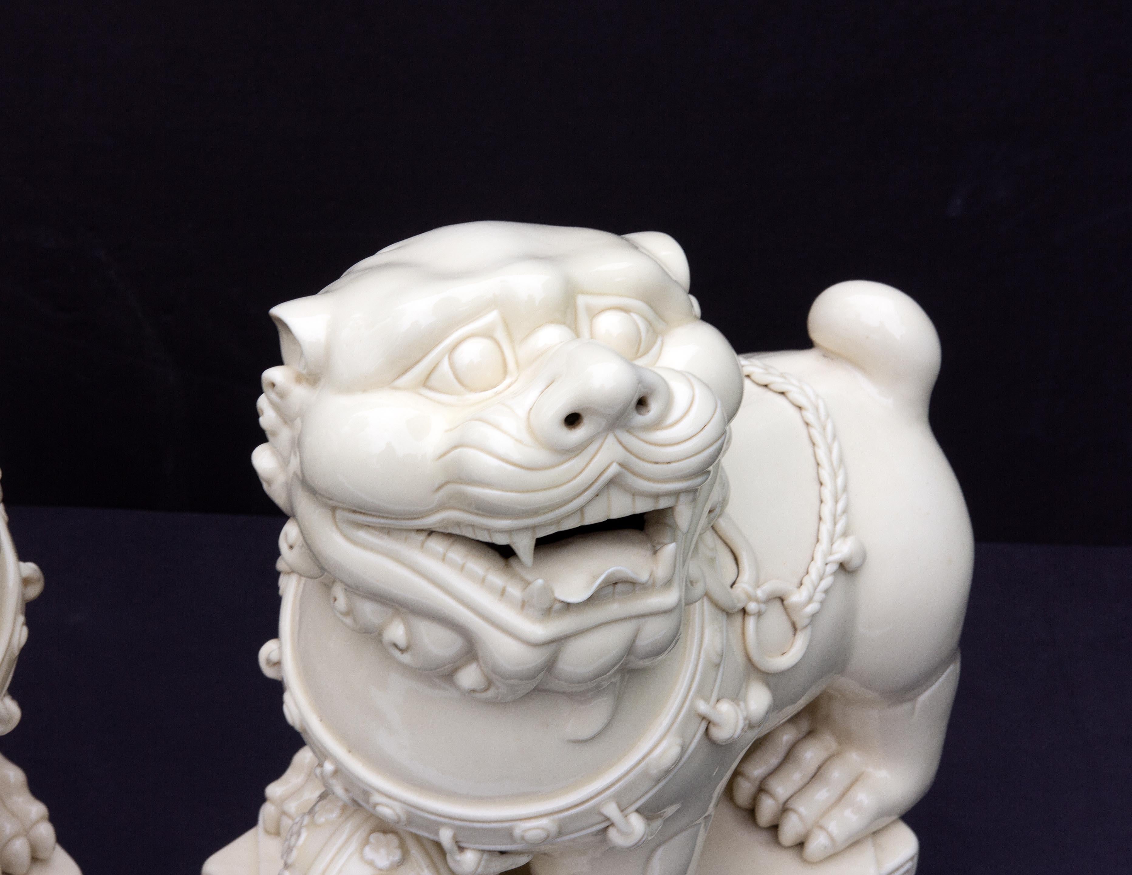 Glazed Pair Chinese Porcelain Dehua Blanc de Chine Foo Dogs For Sale