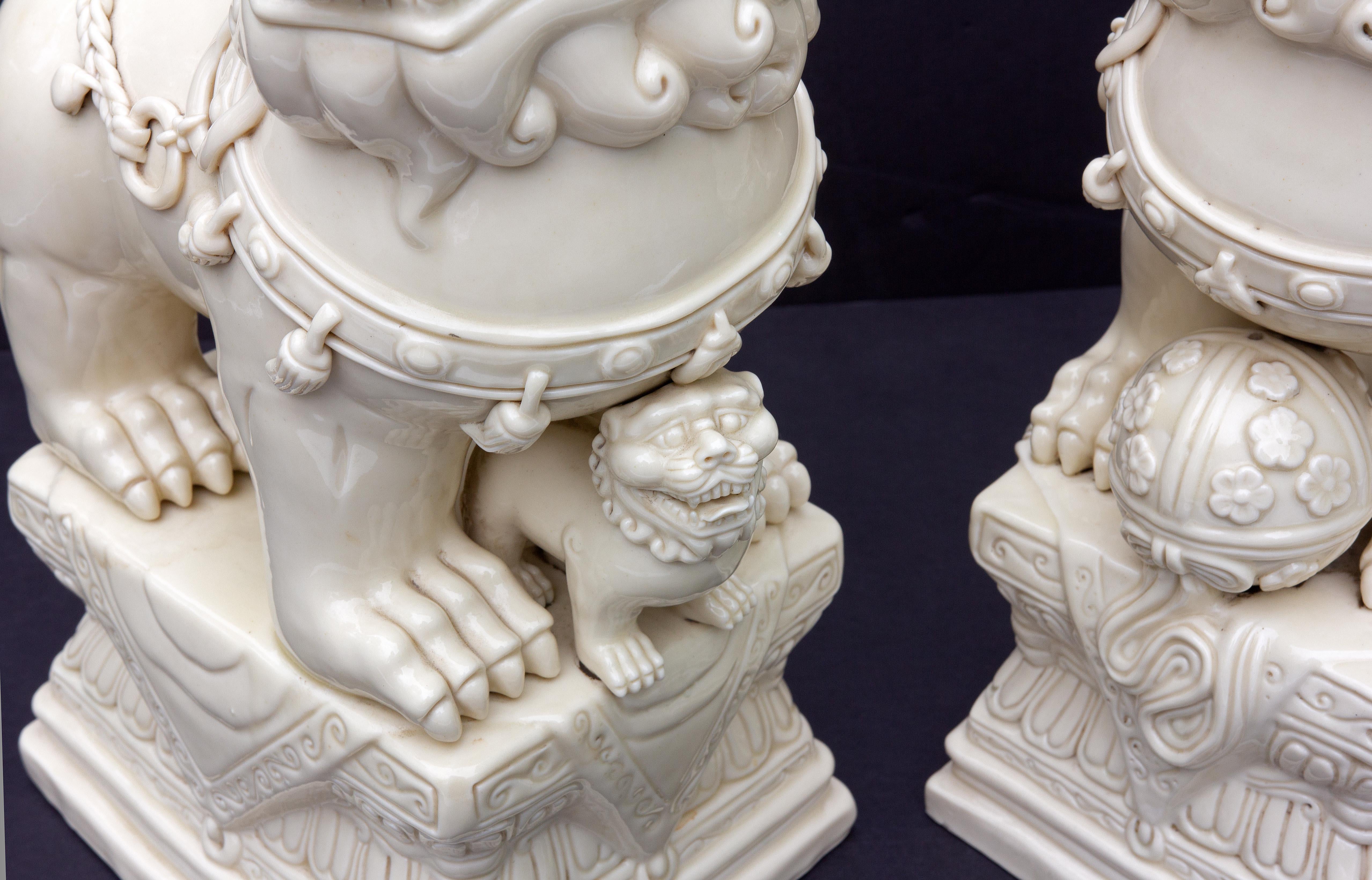 Pair Chinese Porcelain Dehua Blanc de Chine Foo Dogs In Excellent Condition For Sale In Rochester, NY
