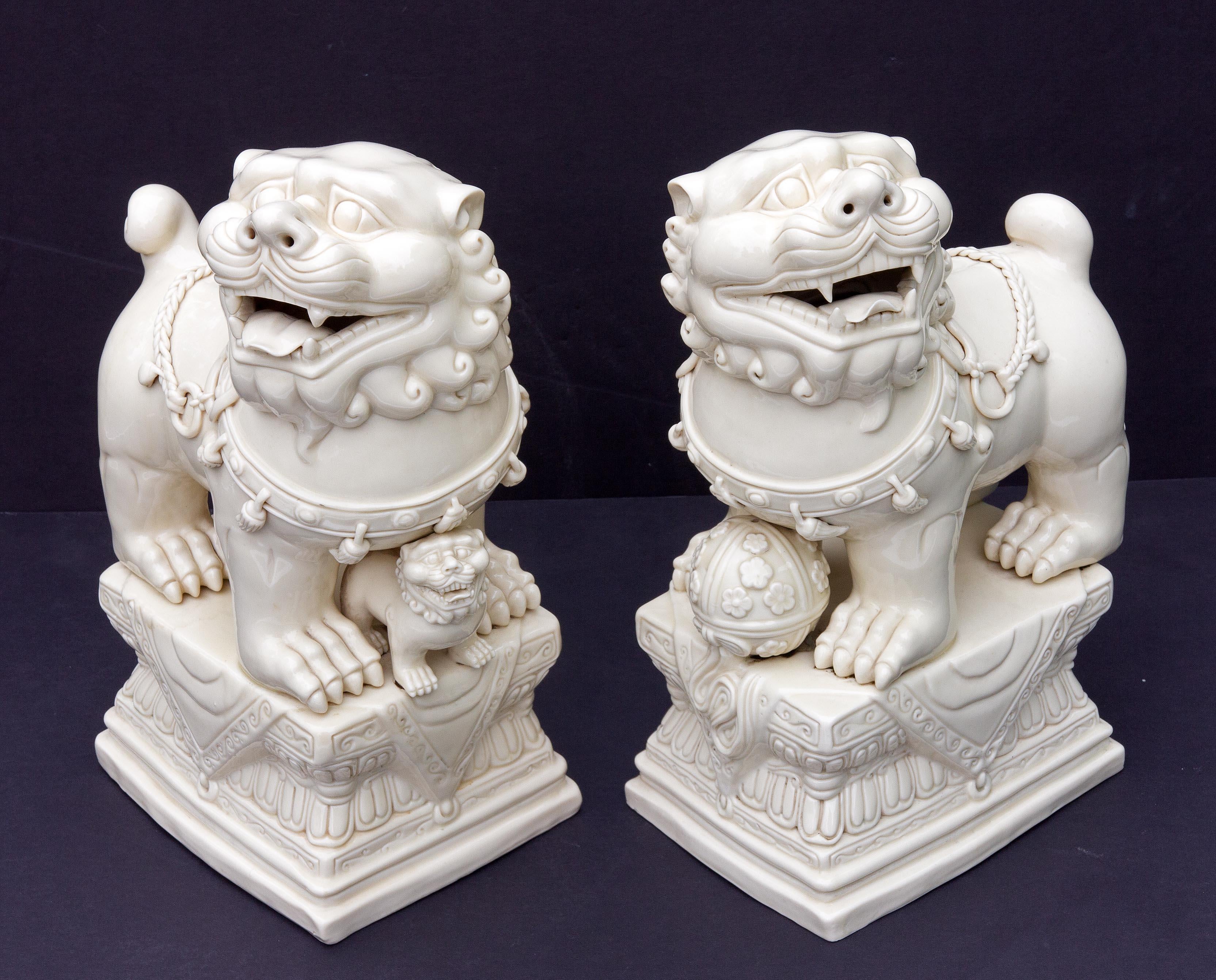 20th Century Pair Chinese Porcelain Dehua Blanc de Chine Foo Dogs For Sale