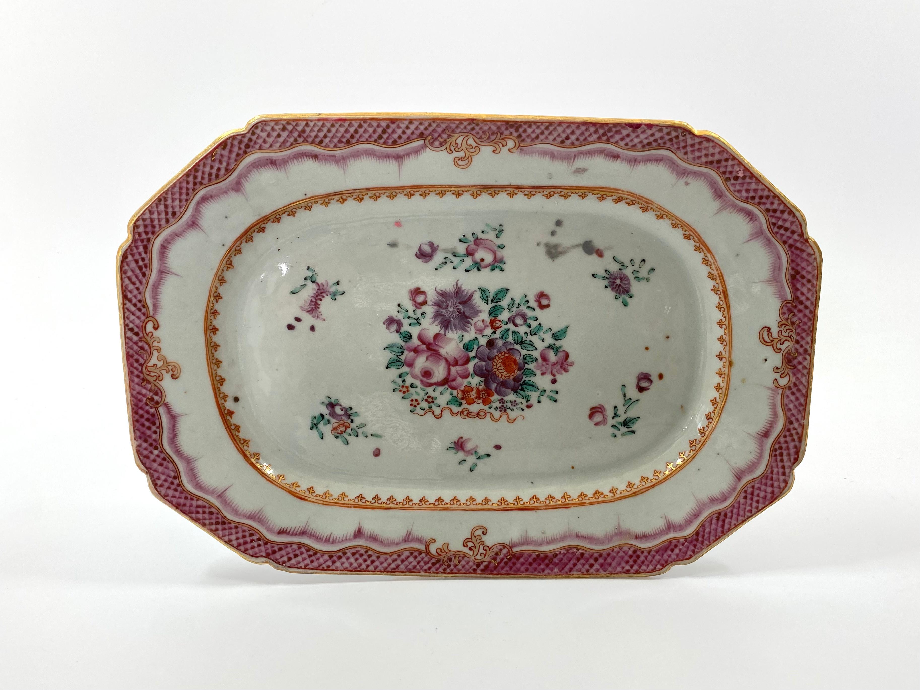 Pair of Chinese porcelain platters, c. 1770, Qianlong Period. Both rectangular platters, with canted corners. Painted in famille rose or fencai enamels, with a central spray of flowers, above a ribbon, surrounded by smaller sprigs of flowers.
The