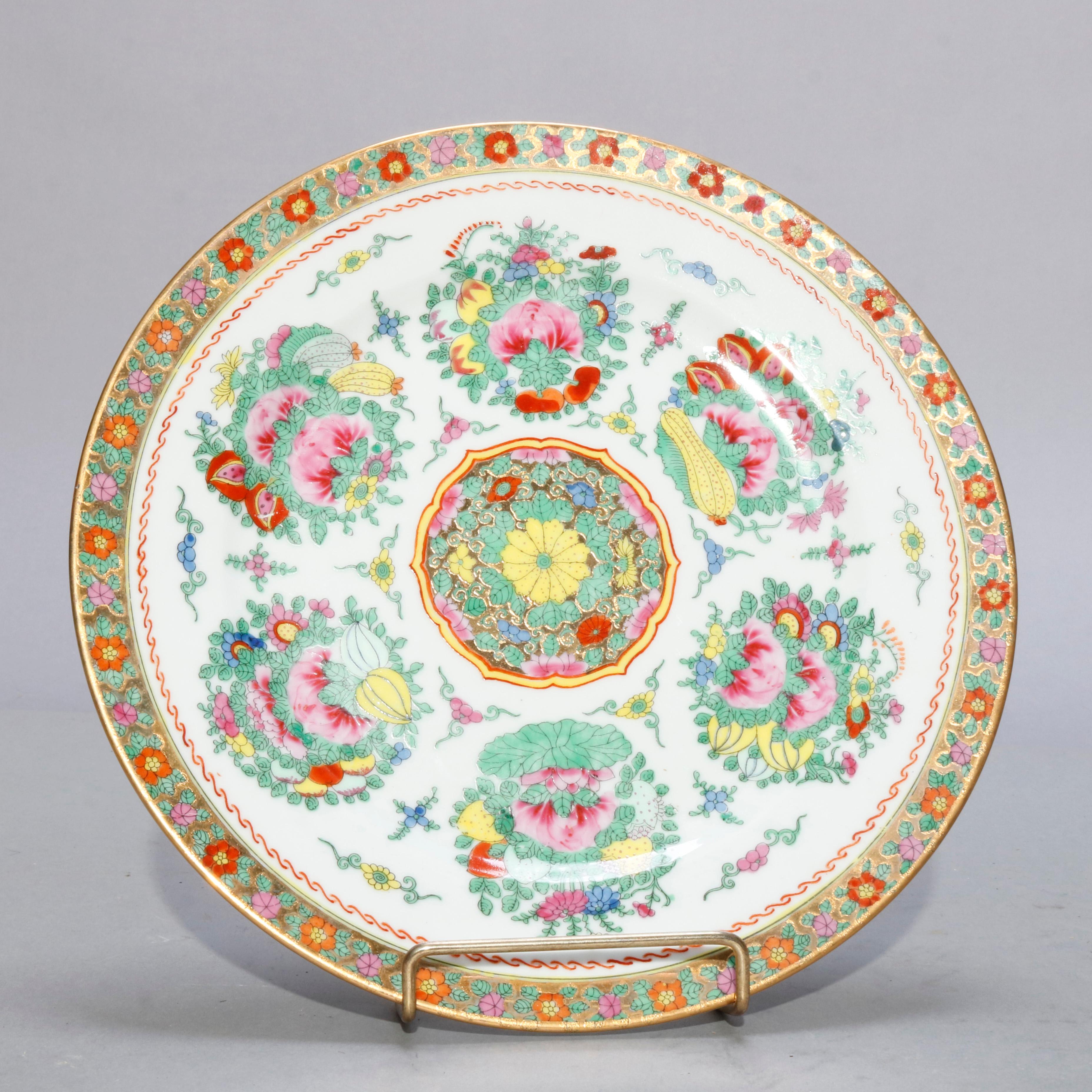 A pair of Chinese porcelain plates offer central floral medallion surrounded by floral reserves, gilt highlighting throughout, en verso maker stamp, 20th century

Measures- 1